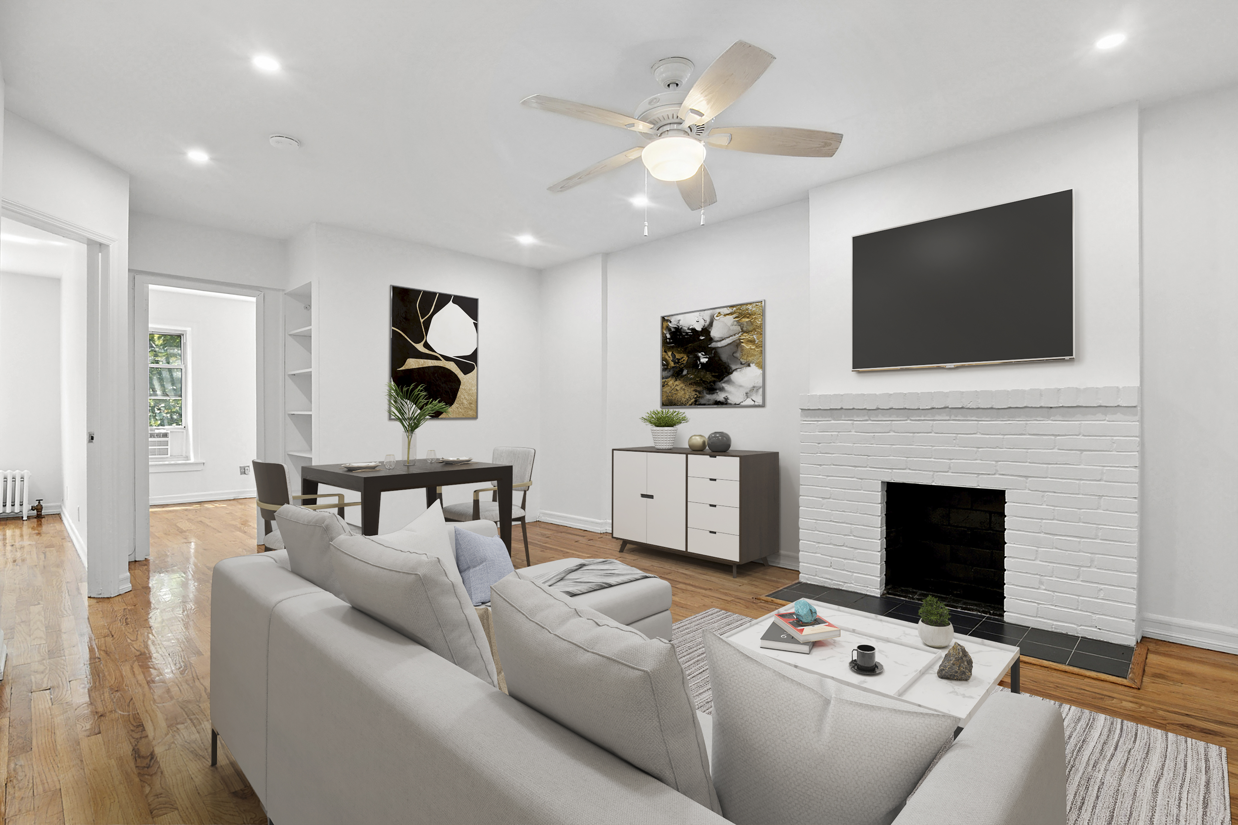 104 Dean Street, Unit 3R Brooklyn, NY 11201 - Photo 1 of 6 a living room with furniture a flat screen tv and a fireplace