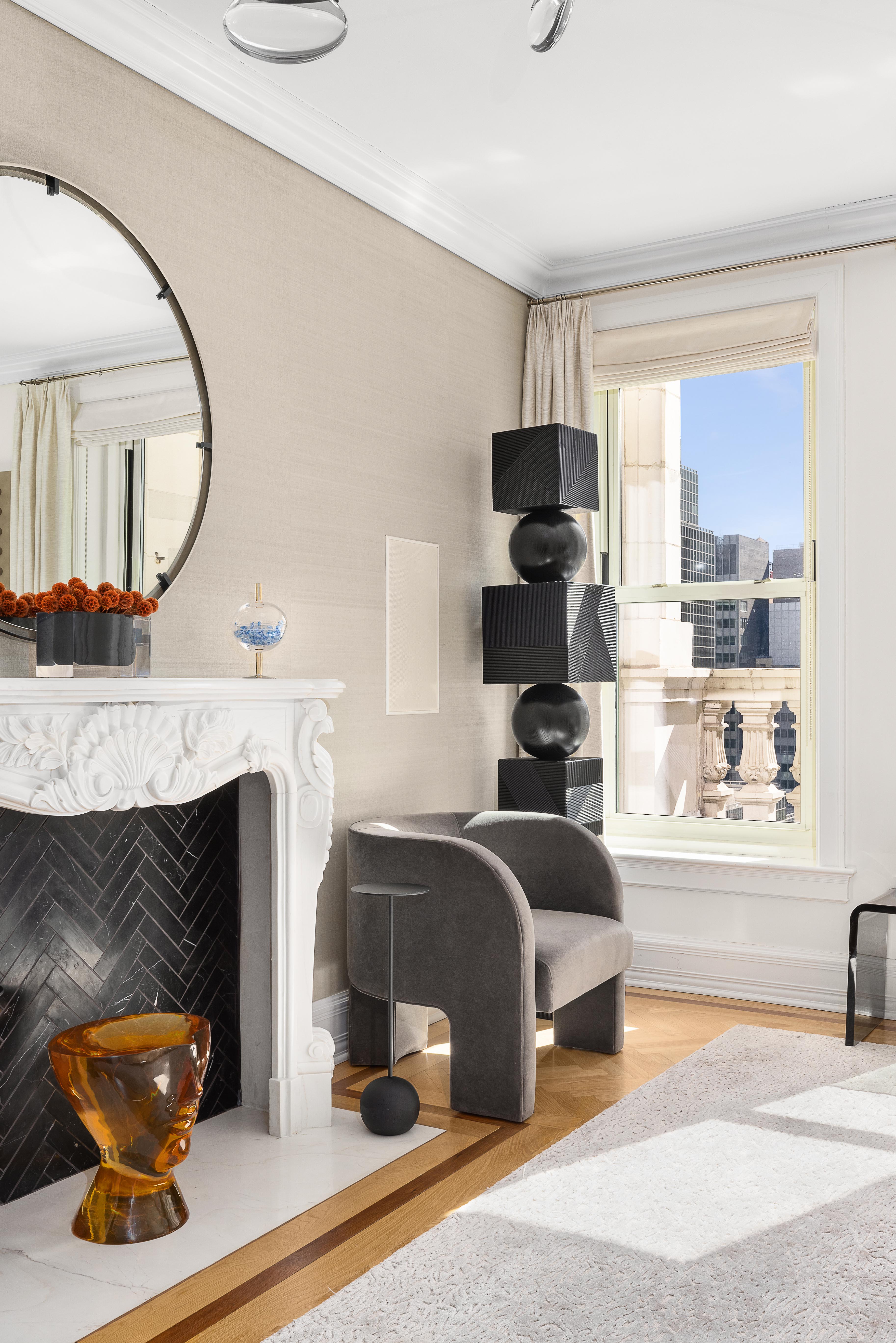 1 Central Park South, Unit 1513 Manhattan, NY 10019 - Photo 5 of 29 a bedroom with a bed a fireplace and a potted plant