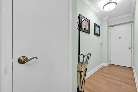 a view of a hallway with paintings on the wall