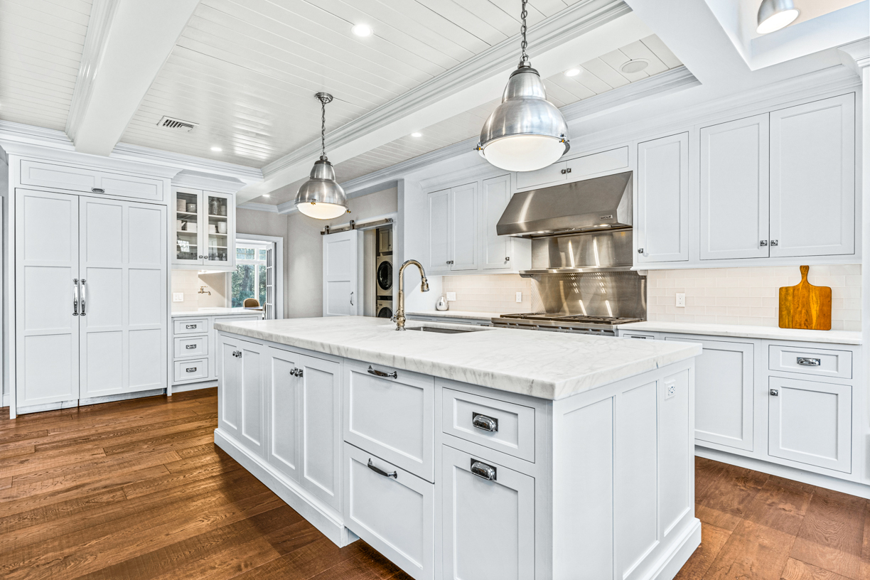 165 Bridle Trail Road Needham, MA 02492 - Photo 4 of 21 a kitchen with stainless steel appliances granite countertop a sink and cabinets with wooden floor