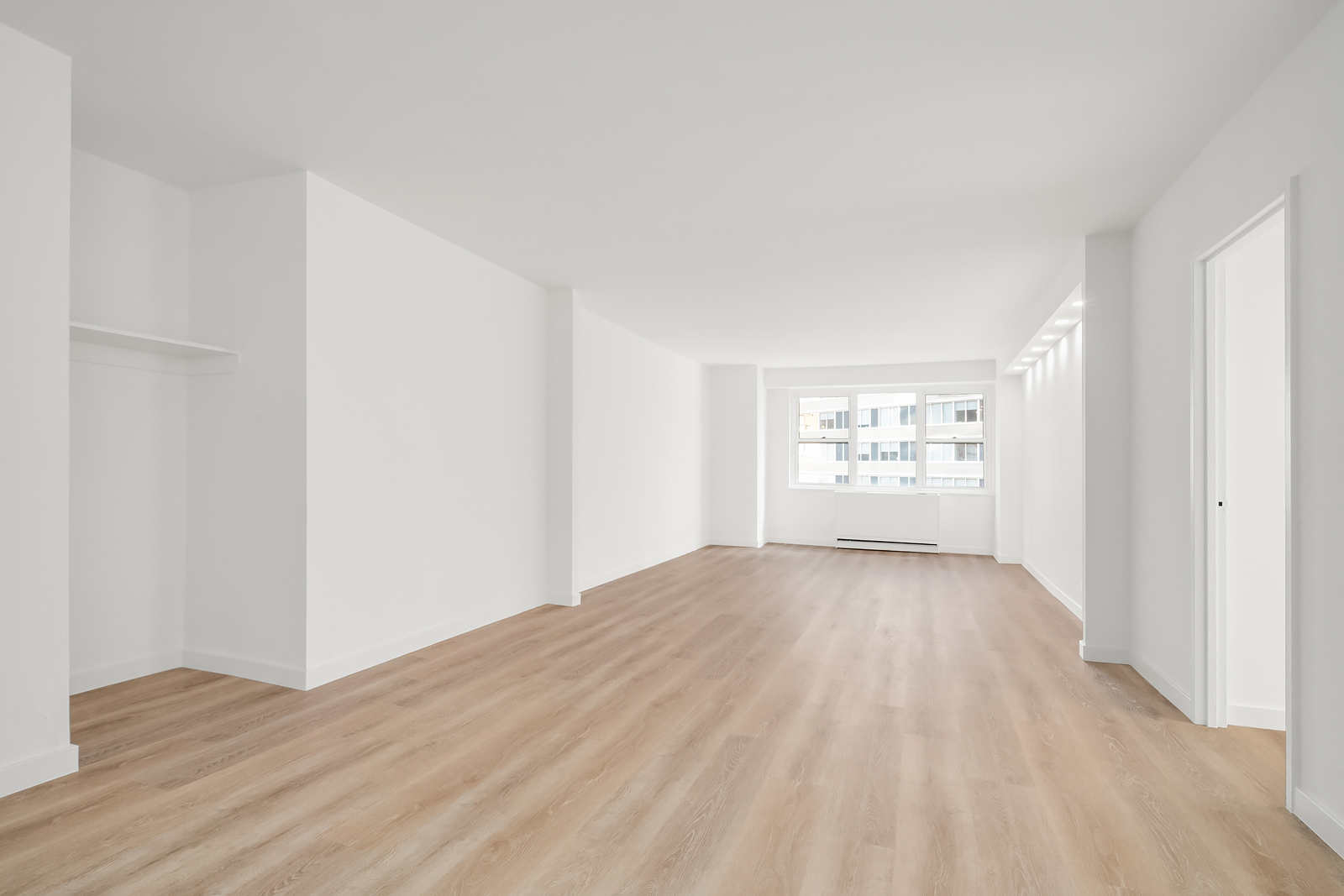 400 East 54th Street, Unit 8A Manhattan, NY 10022 - Photo 7 of 20 a view of empty room with wooden floor