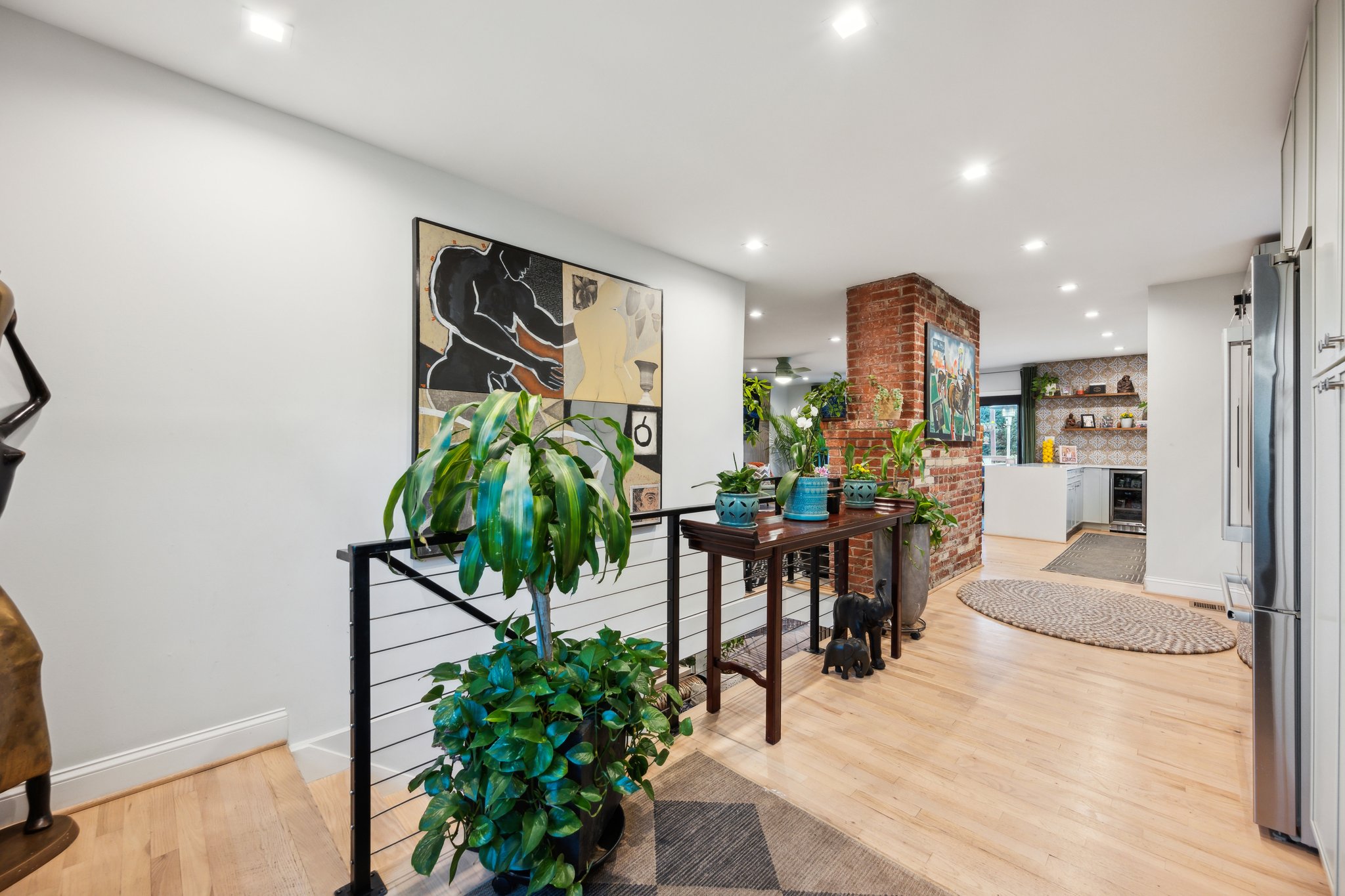2607 Ross Road Chevy Chase, MD 20815 - Photo 24 of 37 a living room with furniture a potted plant and kitchen view
