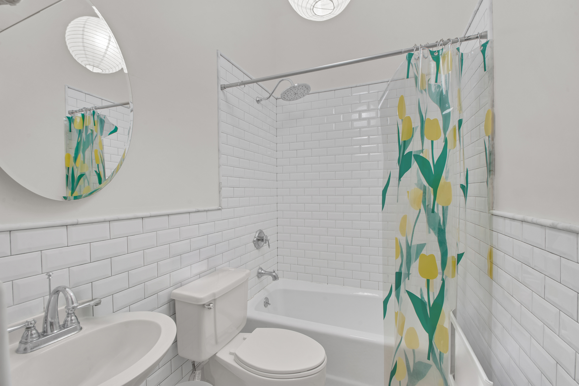 372 Dekalb Avenue, Unit 2H Brooklyn, NY 11205 - Photo 7 of 9 a bathroom with a sink a toilet and bathtub with shower