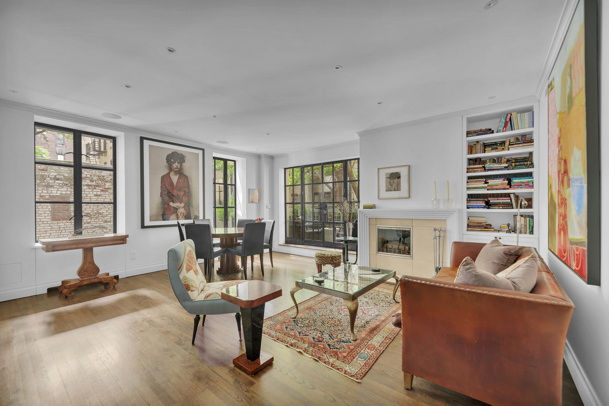 330 West End Avenue, Unit 2B Manhattan, NY 10023 - Photo 2 of 14 a living room with furniture a fireplace and large windows