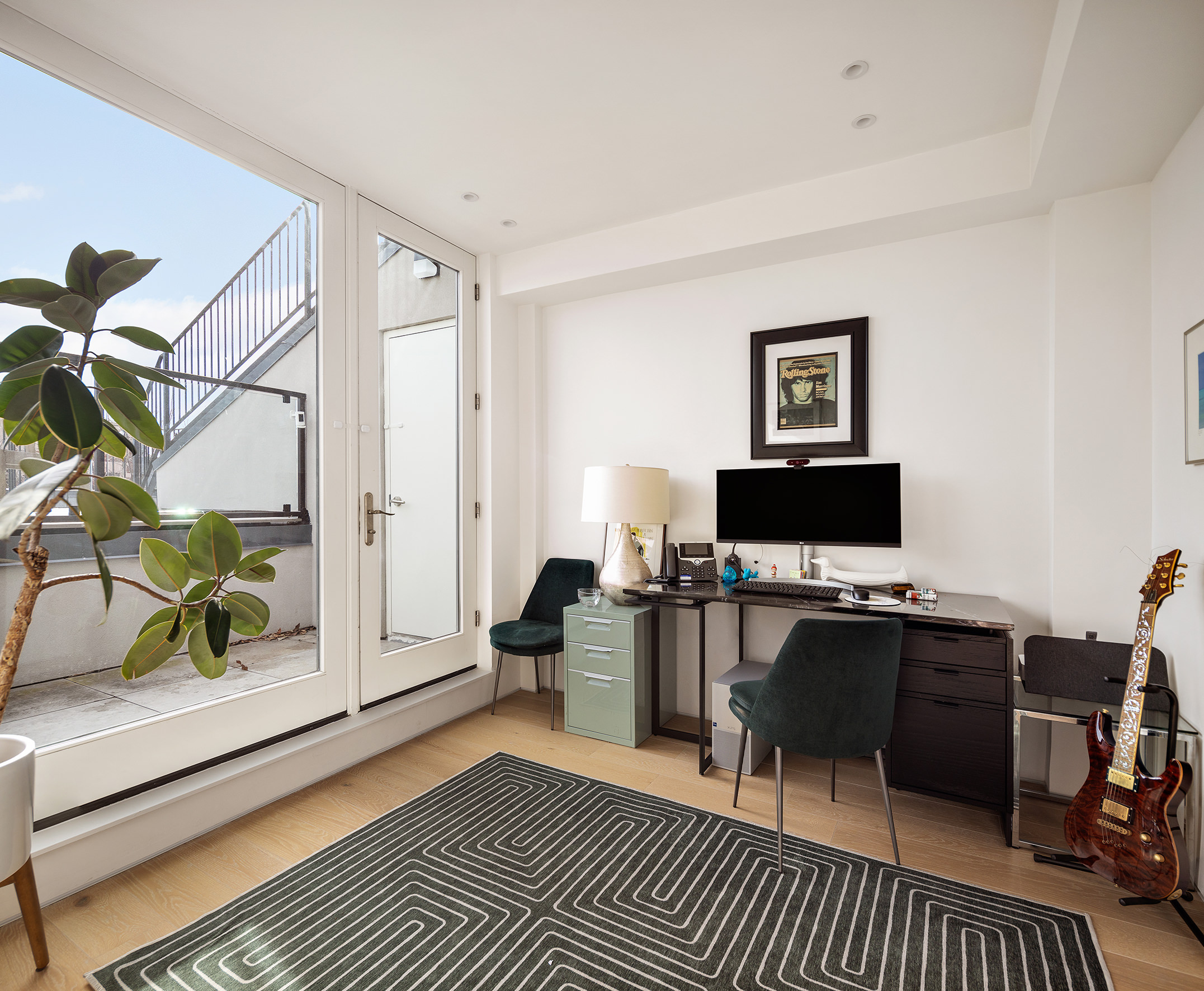 111 Noble Street, Unit 2 Brooklyn, NY 11222 - Photo 9 of 13 a living room with furniture a rug and a floor to ceiling window