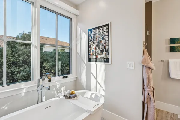 a bathroom with a granite countertop sink a shower and a mirror