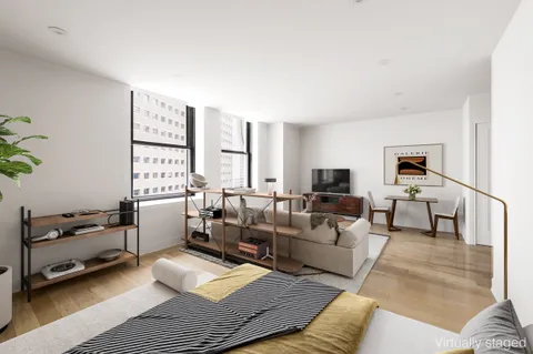 a living room with furniture window and a table