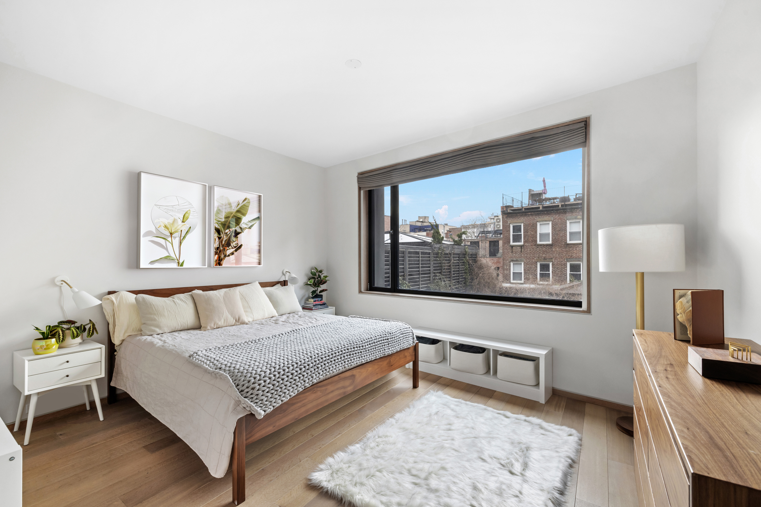 210 Pacific Street, Unit 3E Brooklyn, NY 11201 - Photo 5 of 14 a bedroom with a bed and a couch