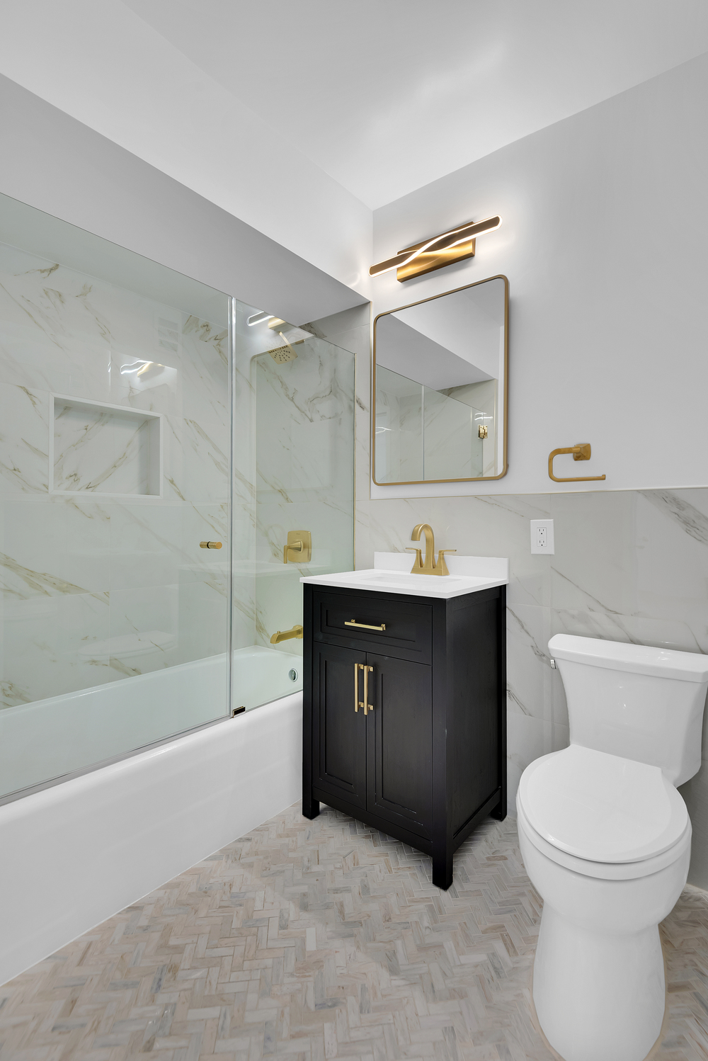 20 West 64th Street, Unit 20K Manhattan, NY 10023 - Photo 10 of 17 a bathroom with a sink vanity mirror and toilet