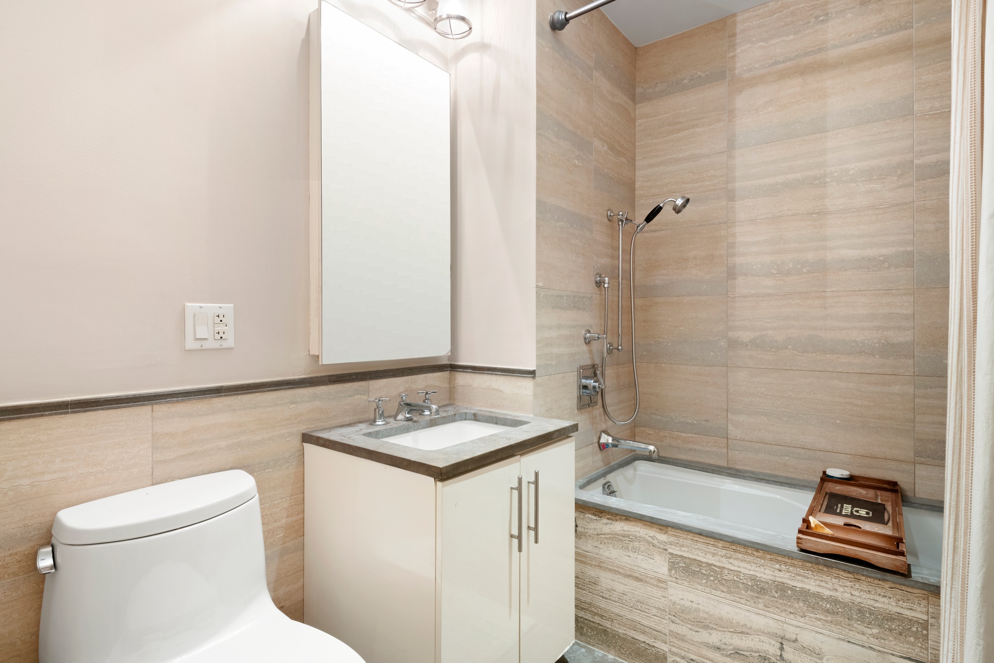 67 Liberty Street, Unit 3 Manhattan, NY 10005 - Photo 7 of 8 a bathroom with a sink toilet and shower