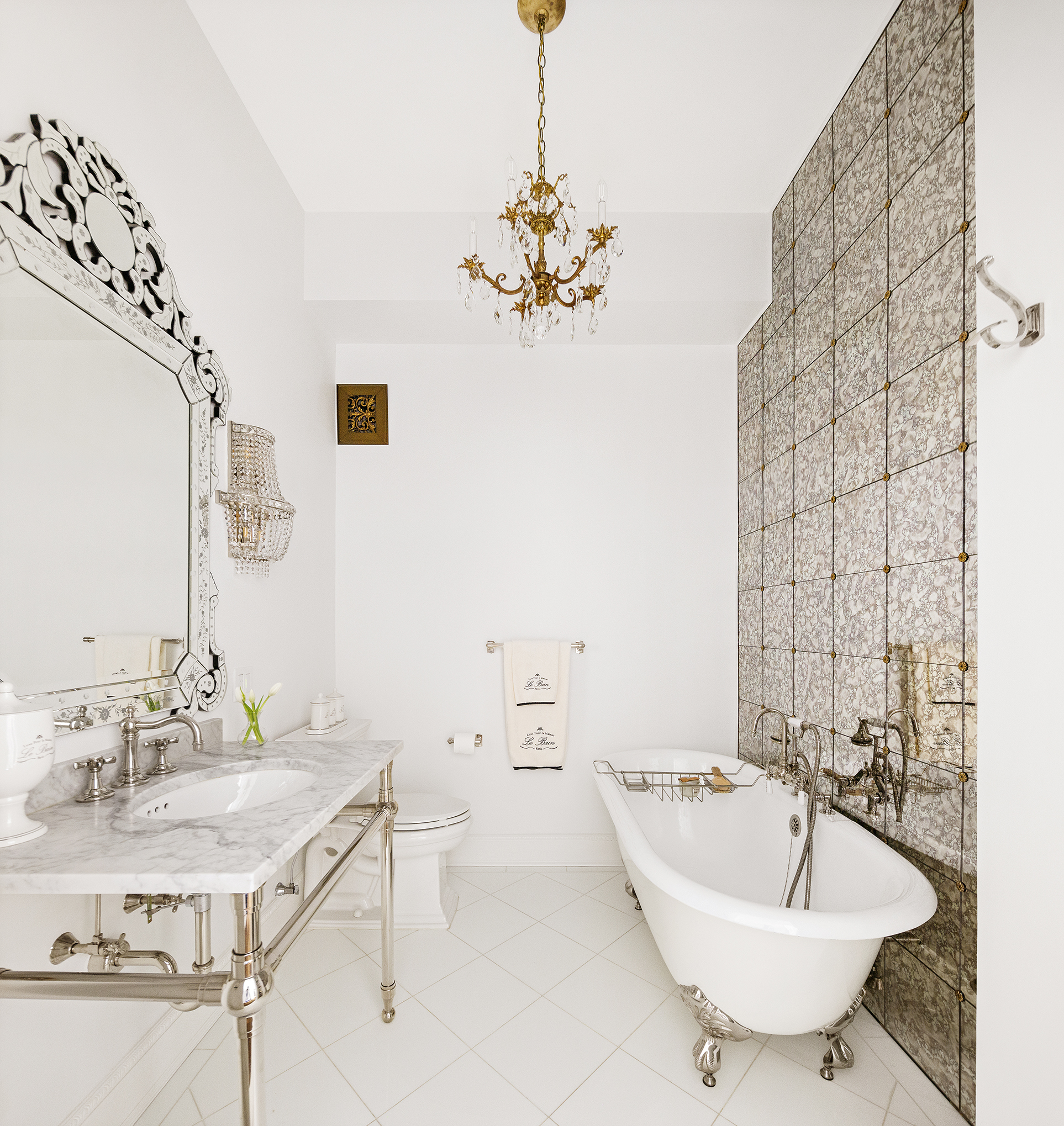 180 West 58th Street, Unit 5A Manhattan, NY 10019 - Photo 7 of 17 a bathroom with a sink and a mirror
