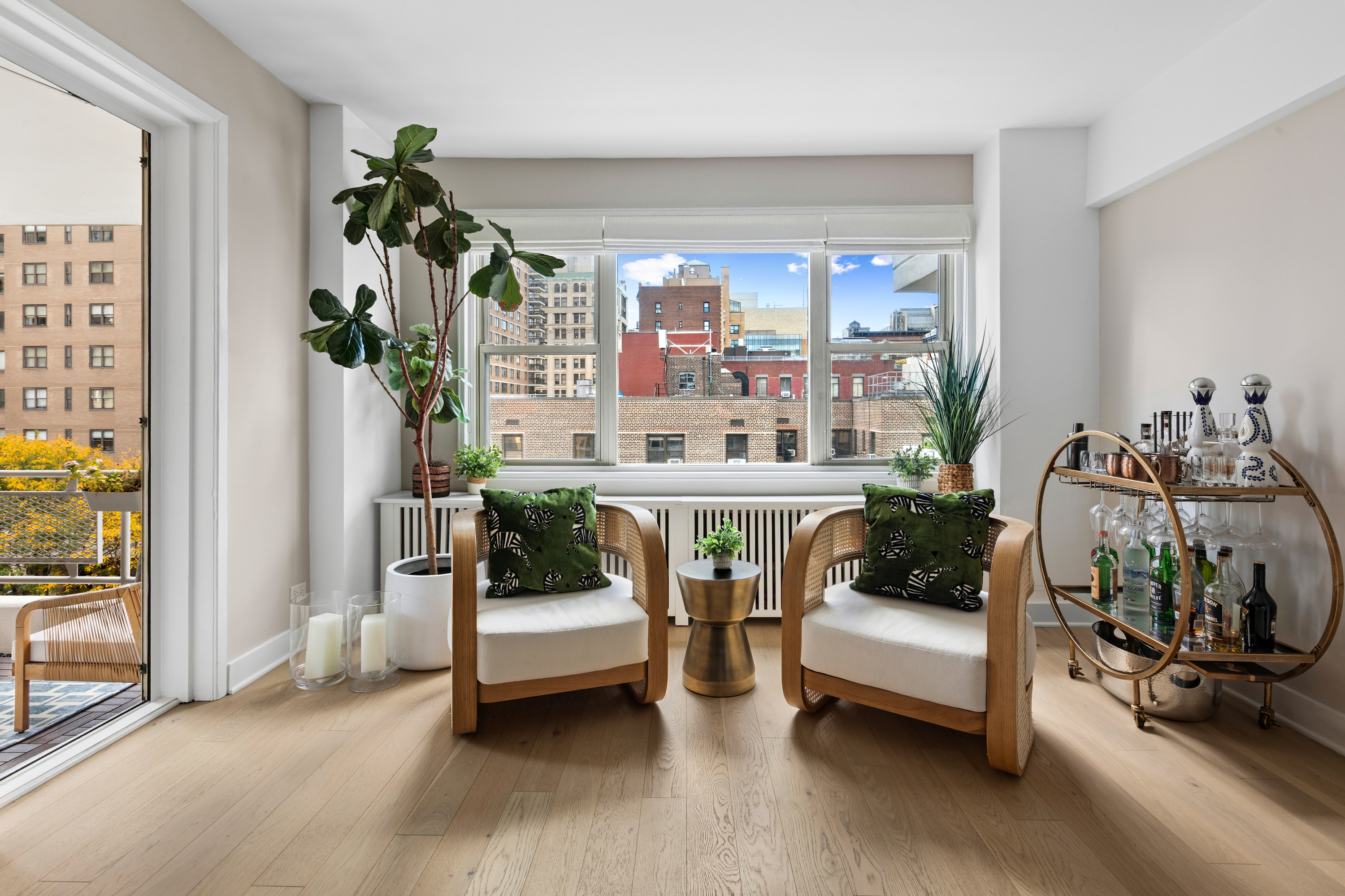 40 East 9th Street, Unit 7L Manhattan, NY 10003 - Photo 5 of 17 a living room with furniture and a potted plant