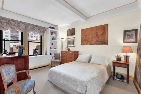 a bedroom with furniture and a couch