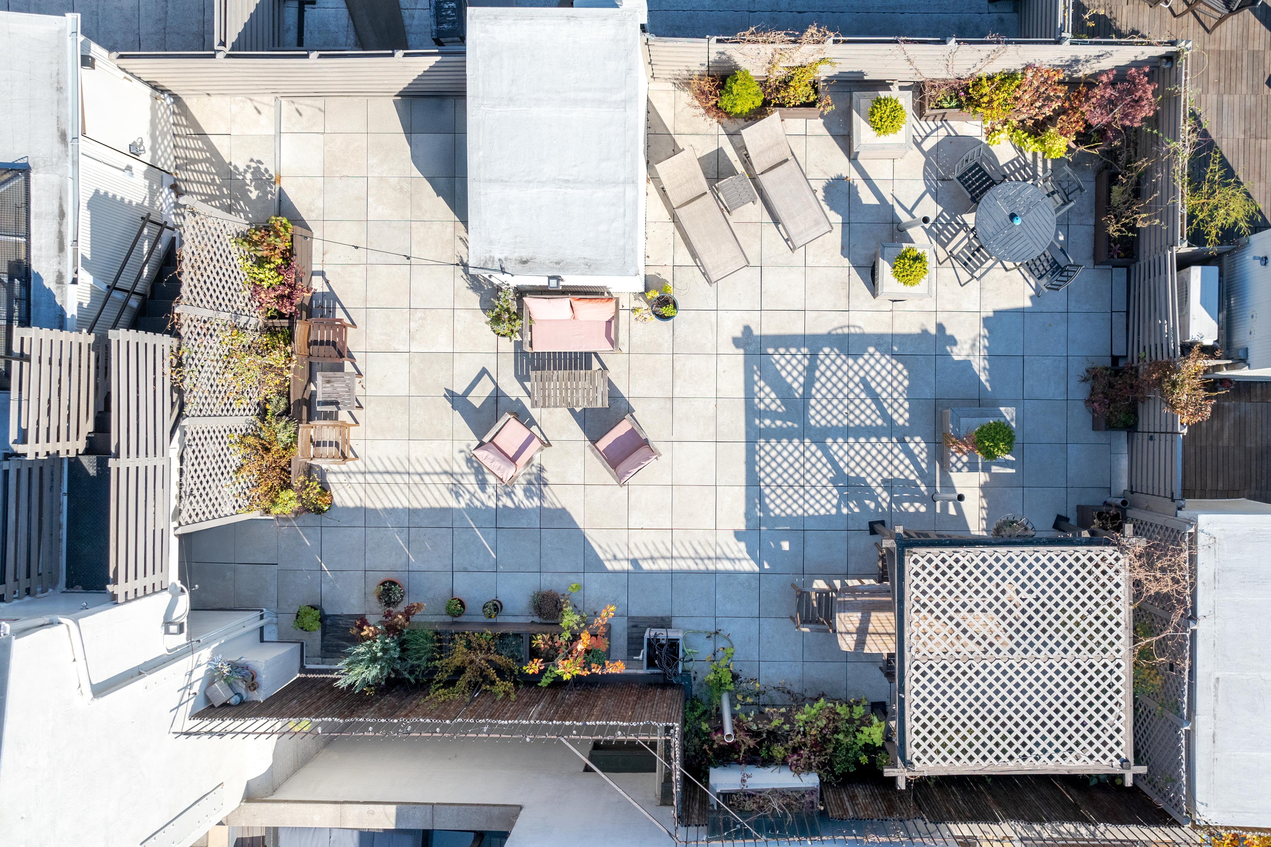 300 East 4th Street, Unit 2A Manhattan, NY 10009 - Photo 12 of 15 a backyard of a house with outdoor seating