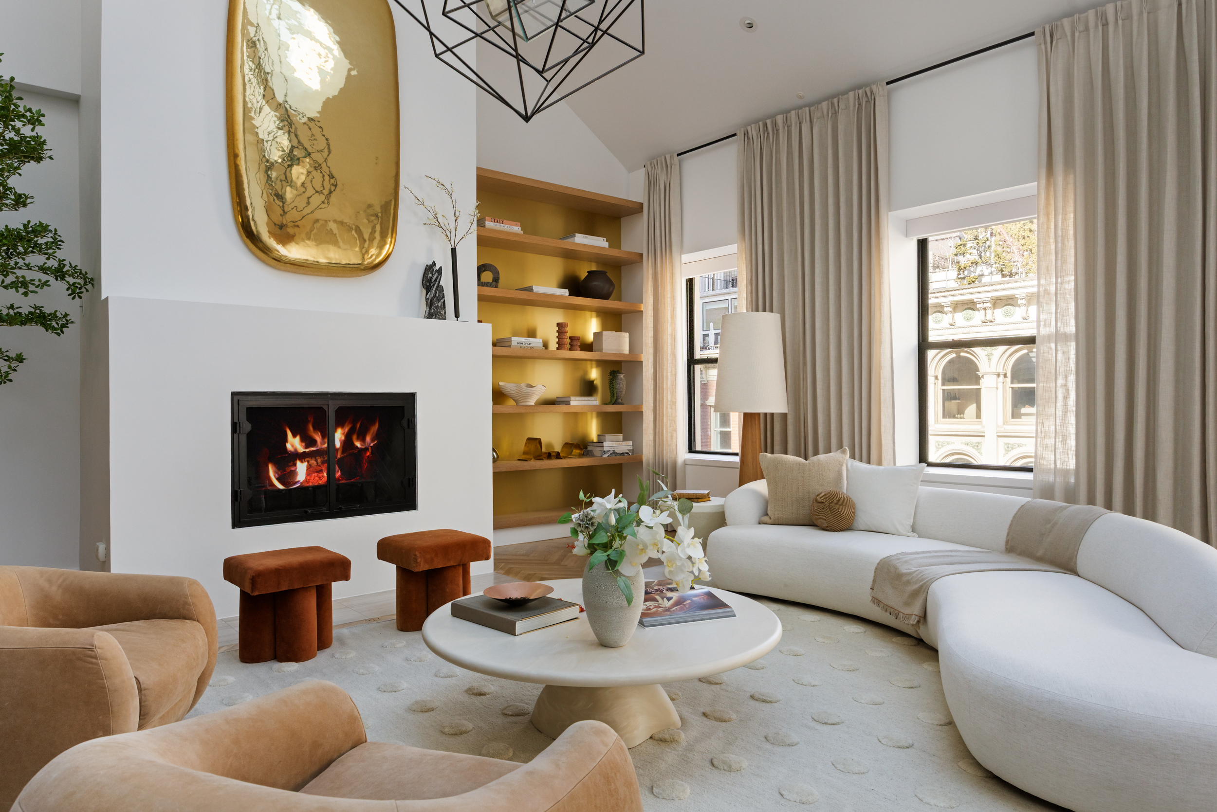 45 Warren Street, Unit PH Manhattan, NY 10007 - Photo 6 of 29 a living room with furniture potted plant a fireplace and a window