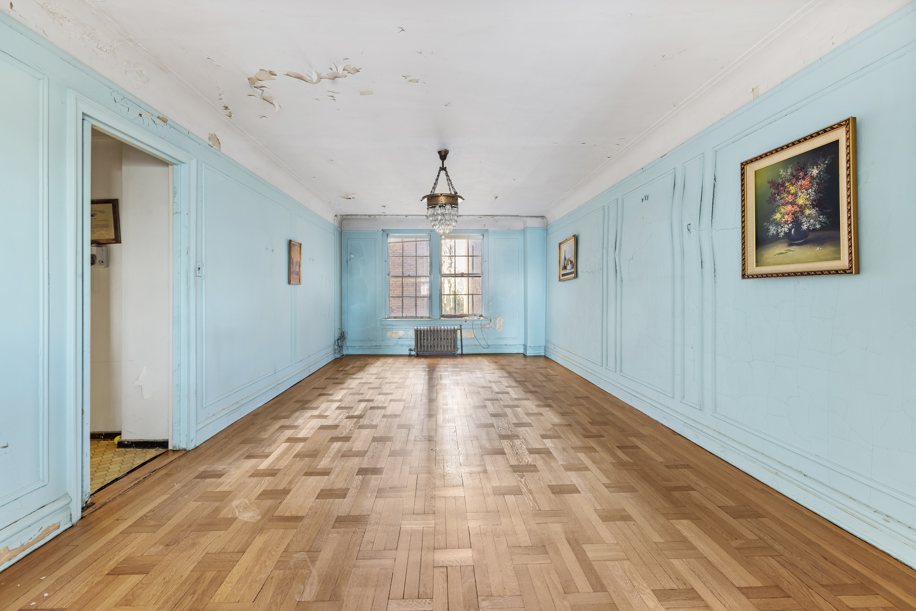 285 Riverside Drive, Unit 5B Manhattan, NY 10025 - Photo 6 of 10 a view of empty room with wooden floor and fan