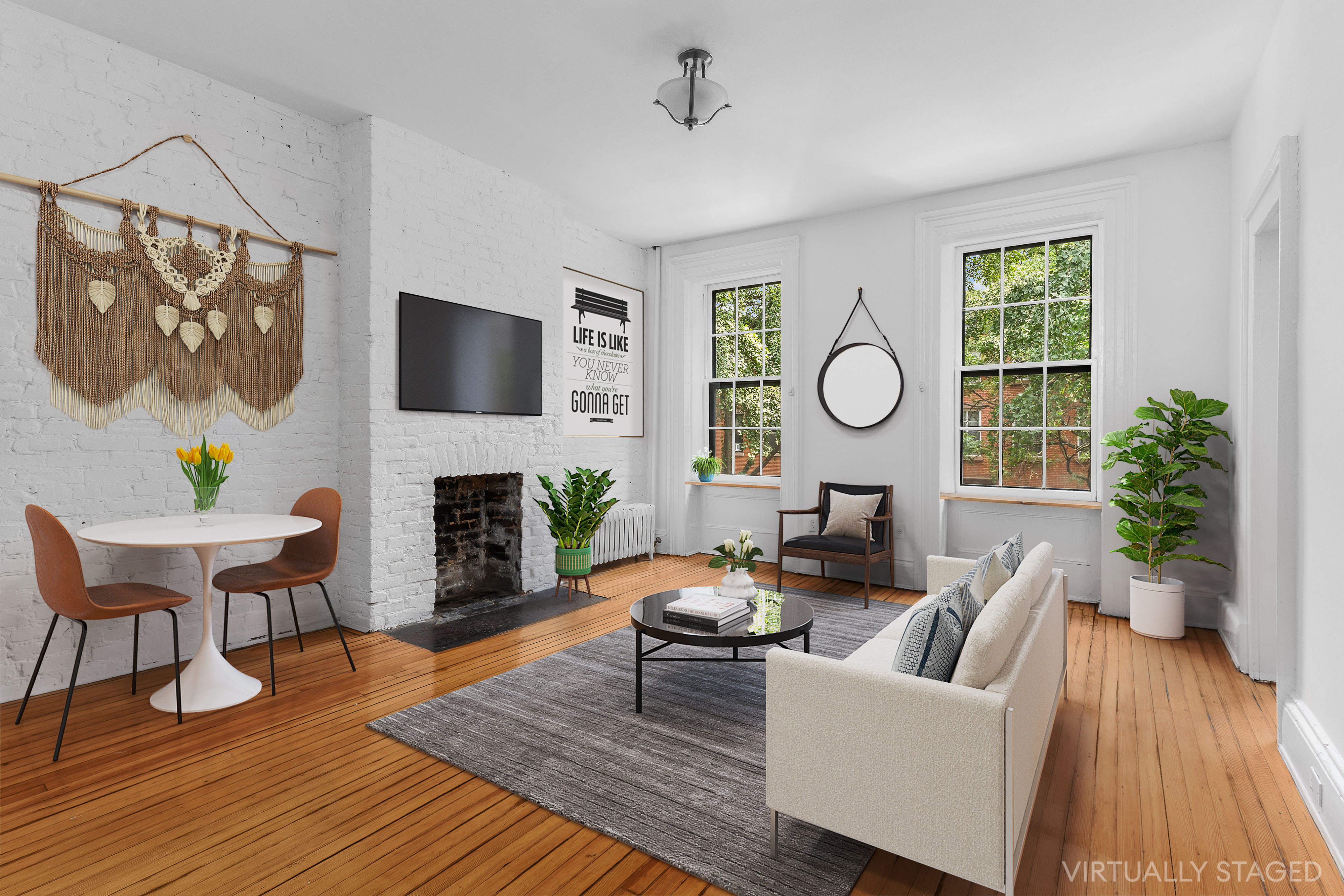 a living room with furniture a fireplace and a flat screen tv