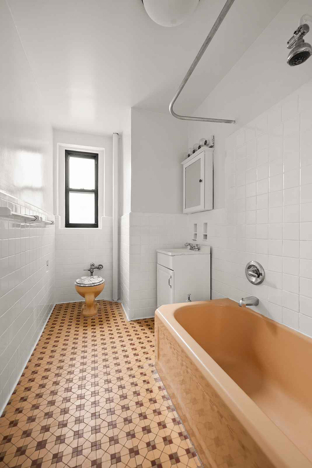 35-30 73rd Street, Unit 1F Queens, NY 11372 - Photo 7 of 10 a bedroom with a bed and a view of bathroom