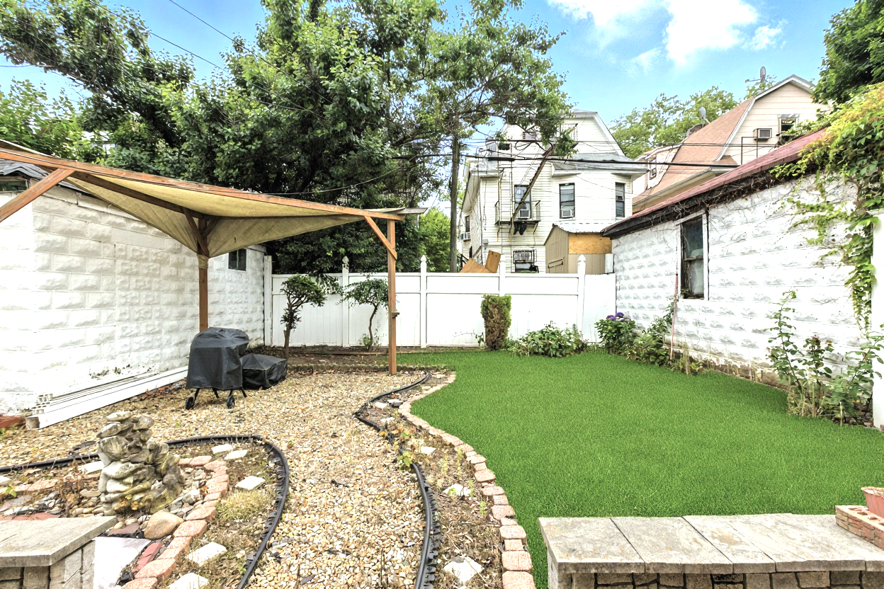 1070 East 13th Street Brooklyn, NY 11230 - Photo 17 of 18 a view of a backyard with sitting area