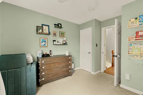 a room with a dresser and mirror