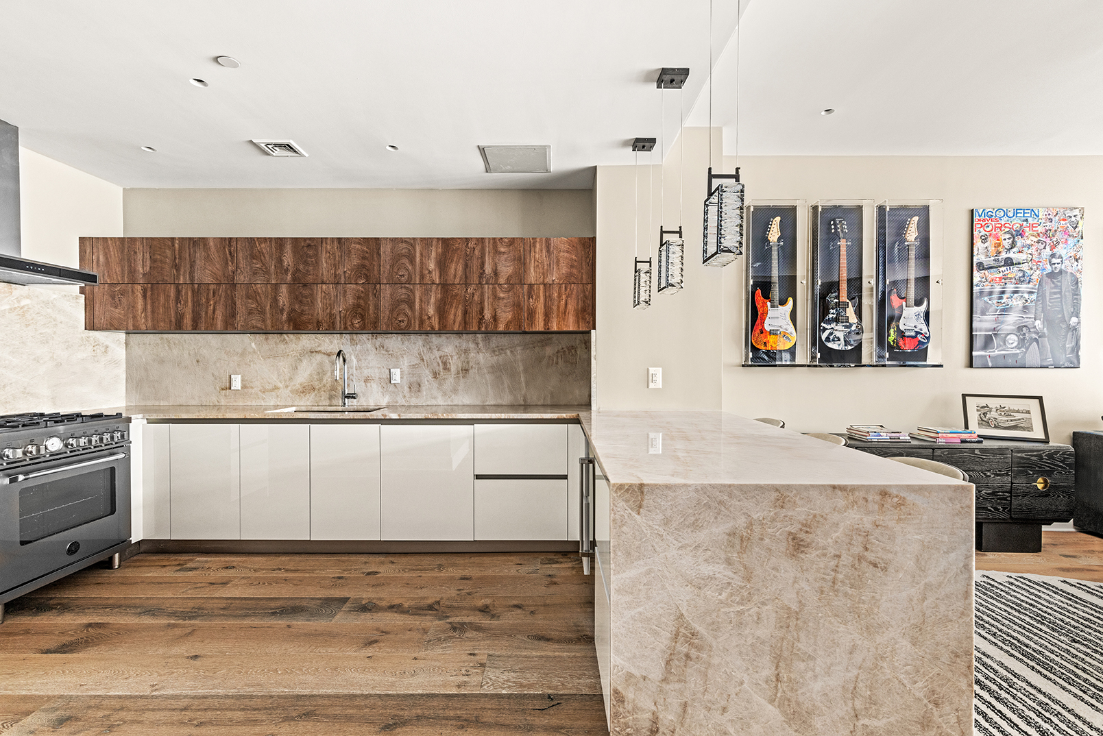128 West 26th Street, Unit 10 Manhattan, NY 10001 - Photo 4 of 15 a kitchen with stainless steel appliances granite countertop a sink stove and cabinets