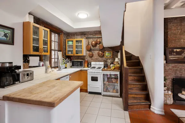 a kitchen with stainless steel appliances granite countertop a stove and a sink