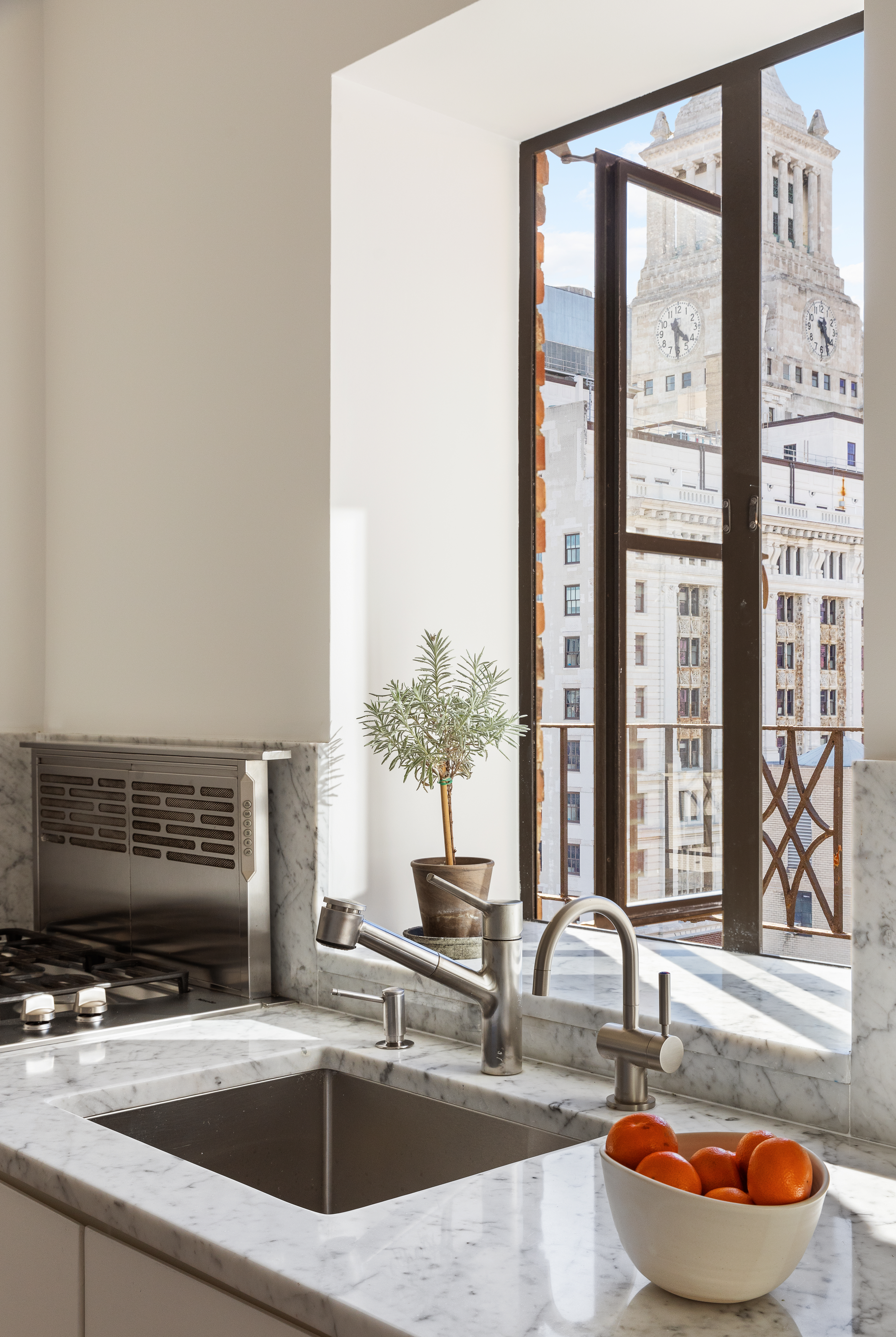 200 East 16th Street, Unit PHC Manhattan, NY 10003 - Photo 4 of 9 a kitchen with a sink and a large window