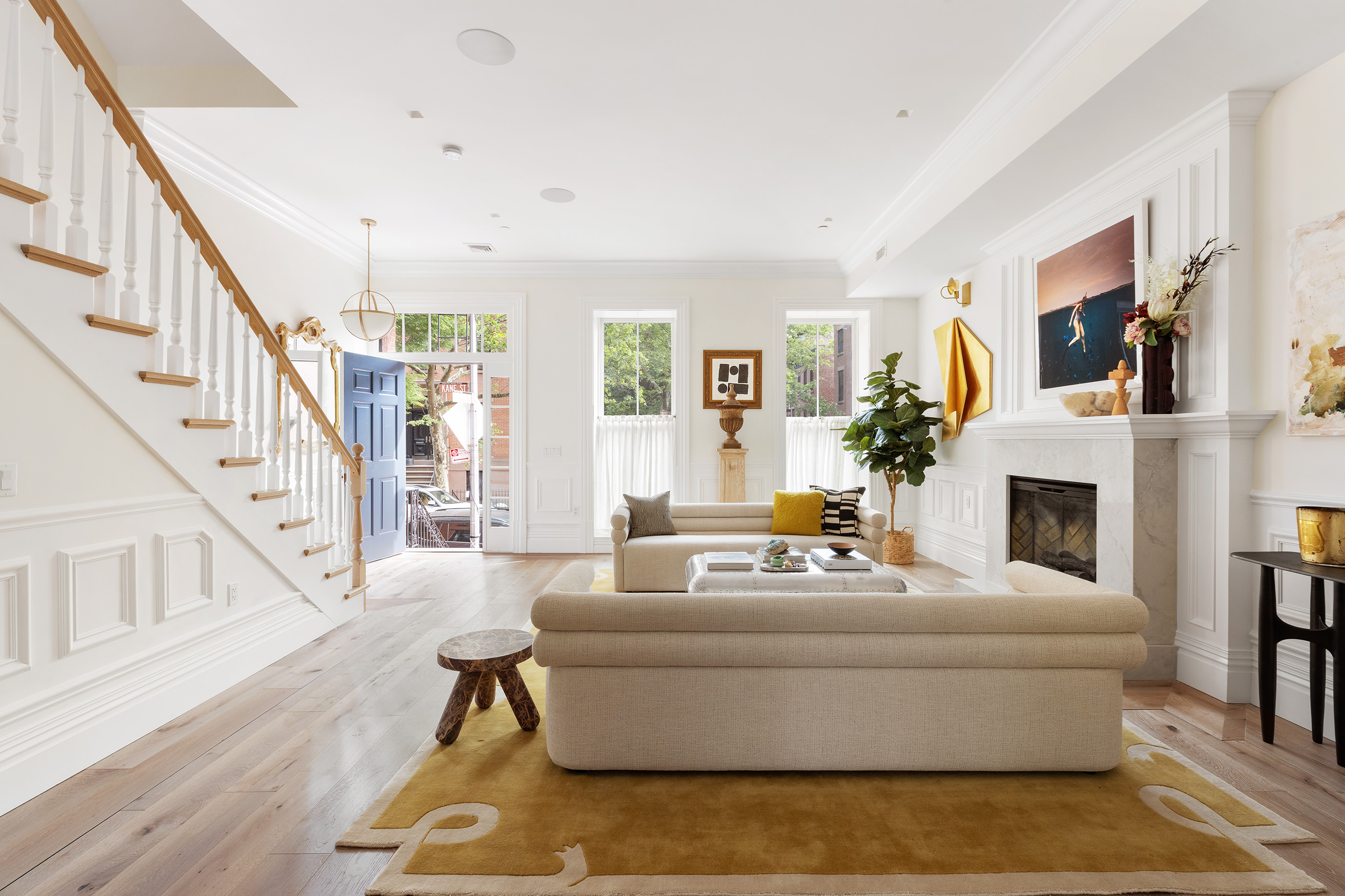 149 Kane Street Brooklyn, NY 11231 - Photo 2 of 26 a living room with furniture a fireplace and a large window