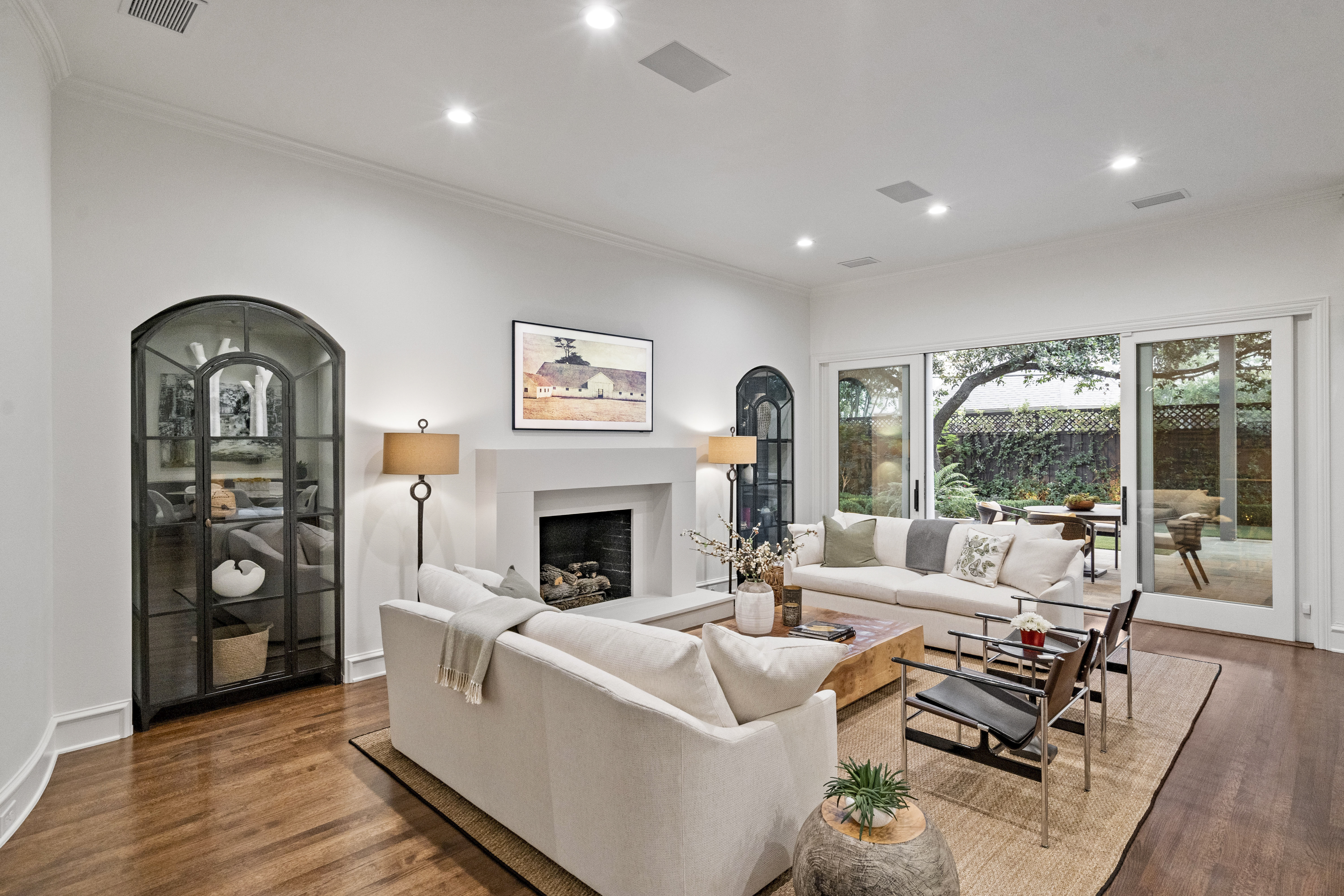 6607 Meadow Road Dallas, TX 75230 - Photo 14 of 32 a living room with furniture and a fireplace