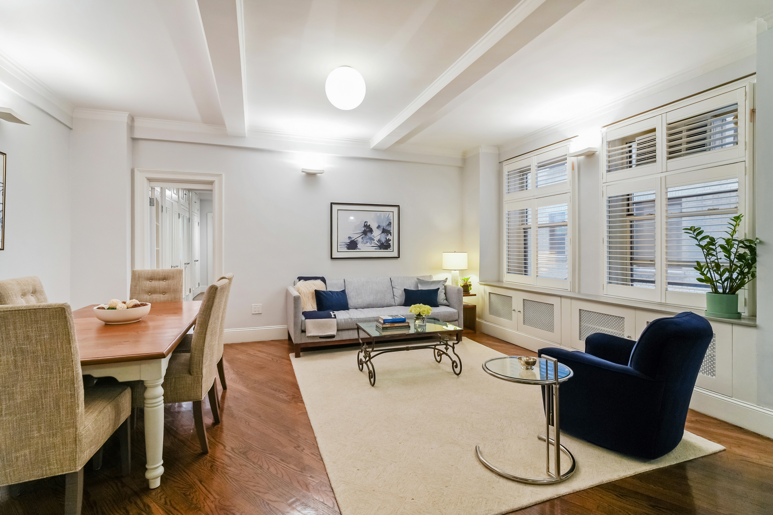 240 West 98th Street, Unit 3D Manhattan, NY 10025 - Photo 2 of 12 a living room with furniture a table and a large window