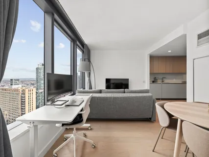 a living room with furniture and flat screen tv