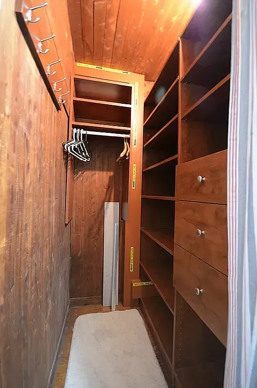 106 Bedford Street, Unit 5B Manhattan, NY 10014 - Photo 4 of 4 a view of walk in closet with empty racks