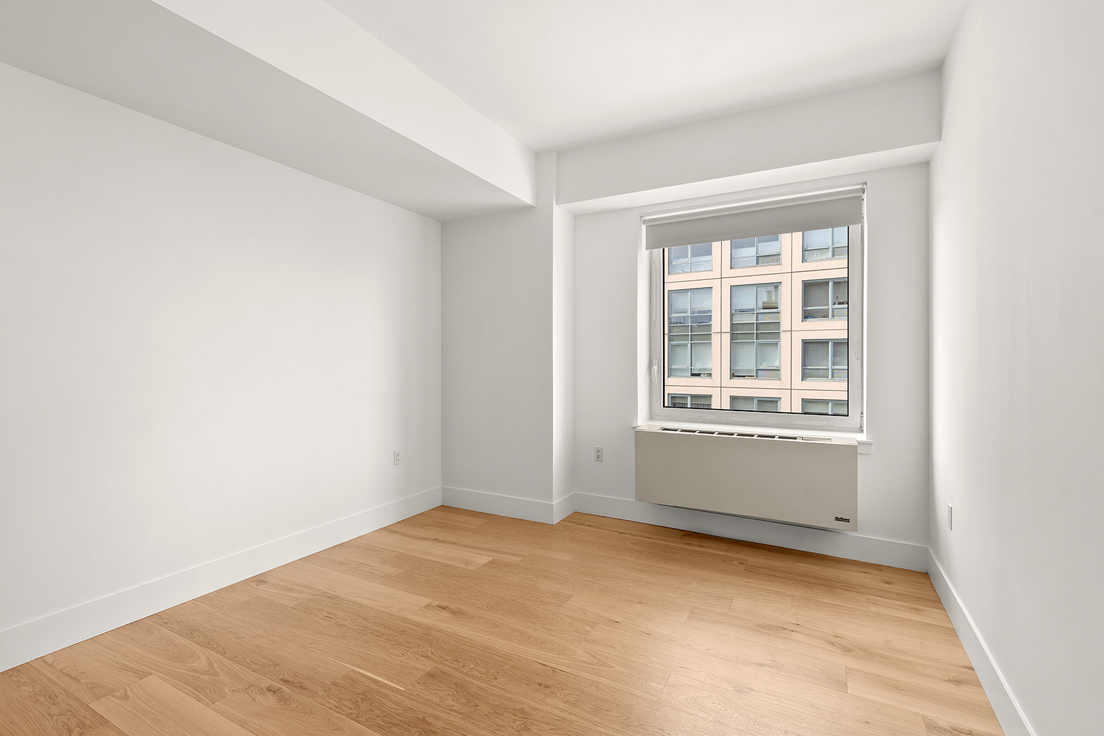 446 Kent Avenue, Unit PHC Brooklyn, NY 11249 - Photo 12 of 22 a view of an empty room with a window