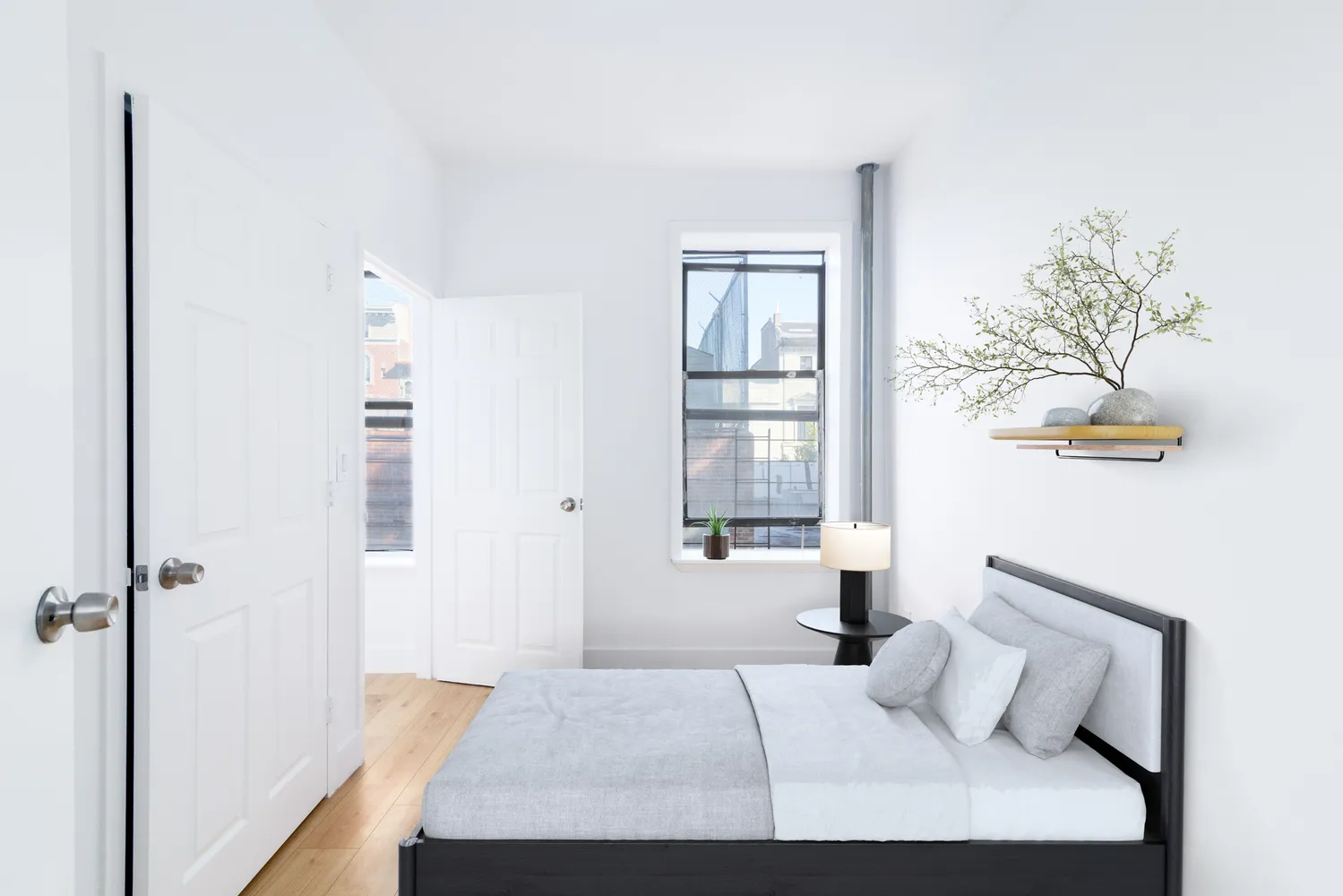 a bedroom with a bed and a window