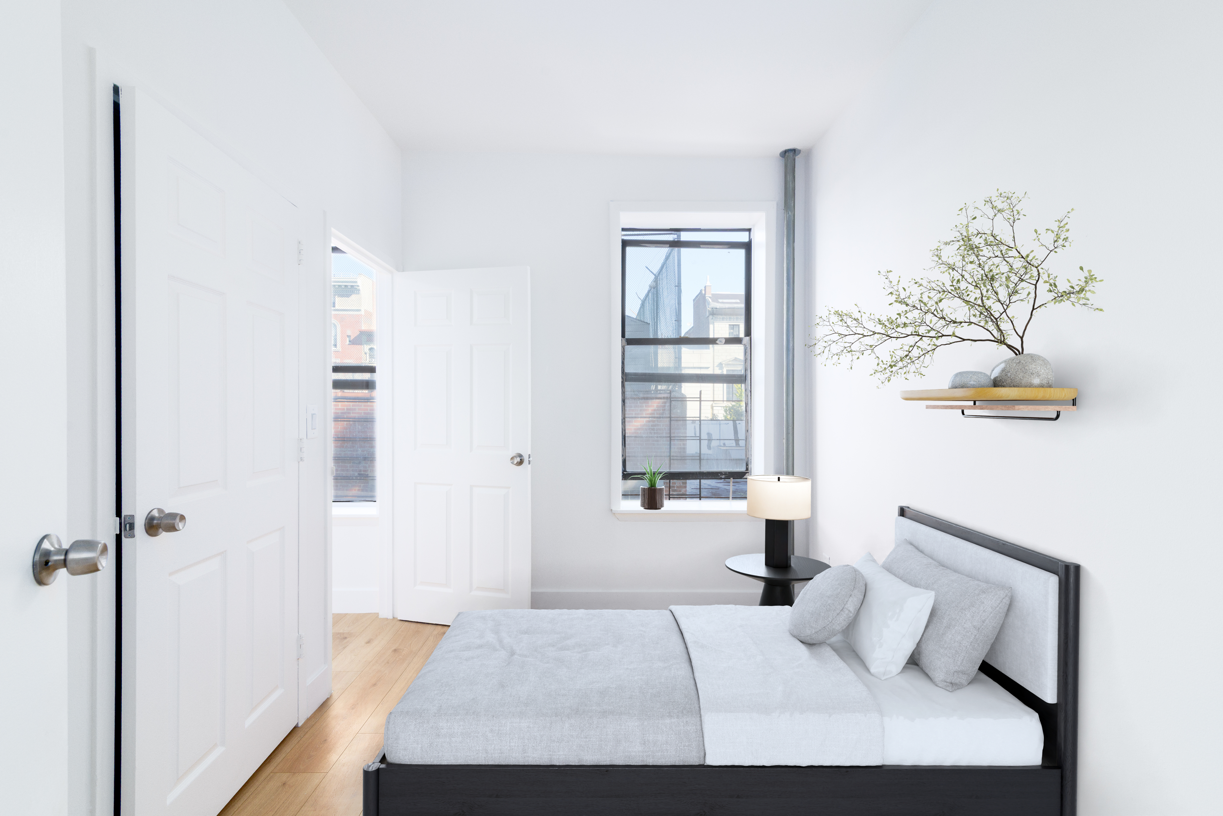 517 West 144th Street, Unit 9 Manhattan, NY 10031 - Photo 9 of 22 a bedroom with a bed and a window