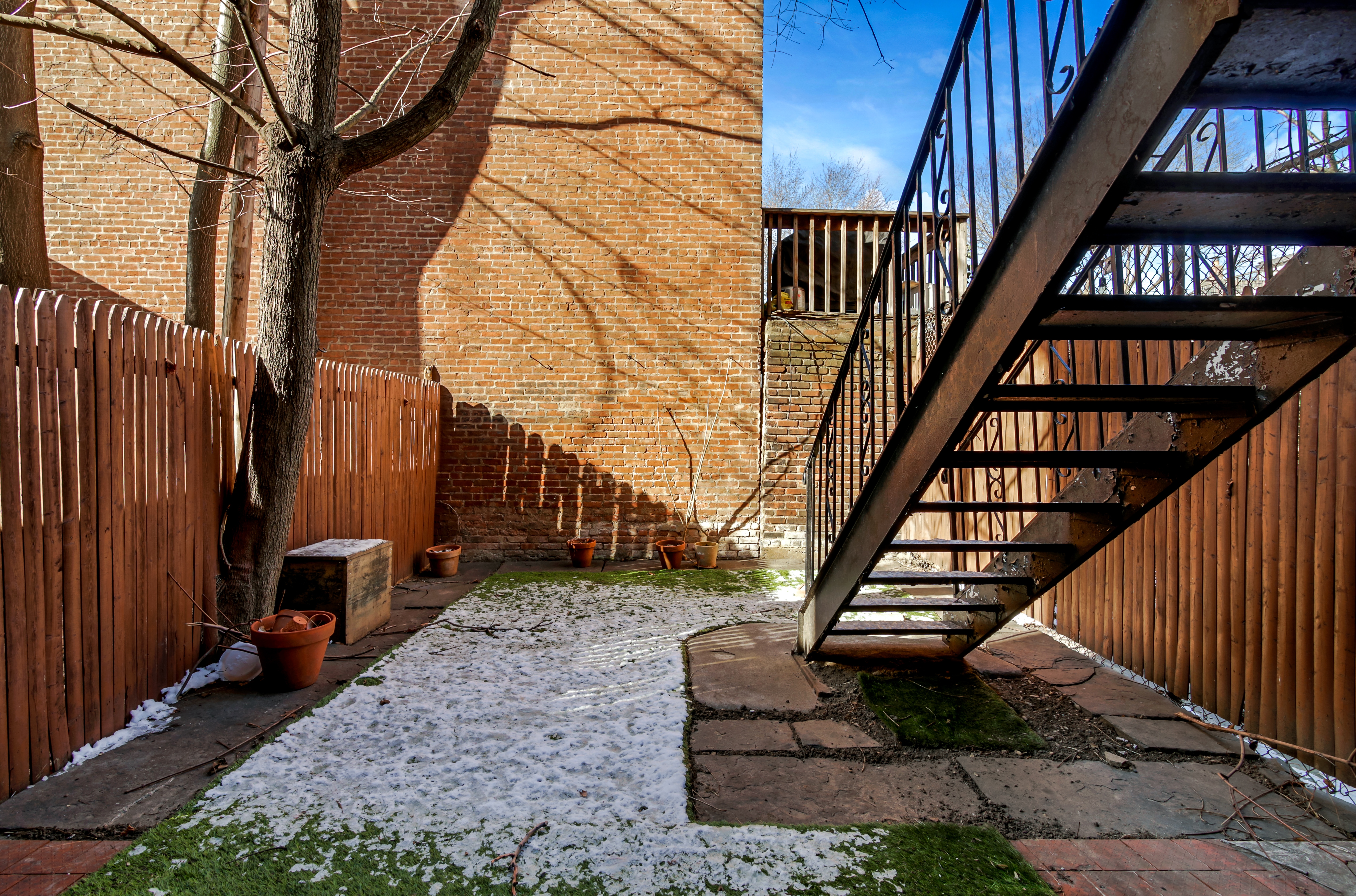 67 Gates Avenue, Unit 1 Brooklyn, NY 11238 - Photo 7 of 7 a view of a house with backyard and wooden stairs