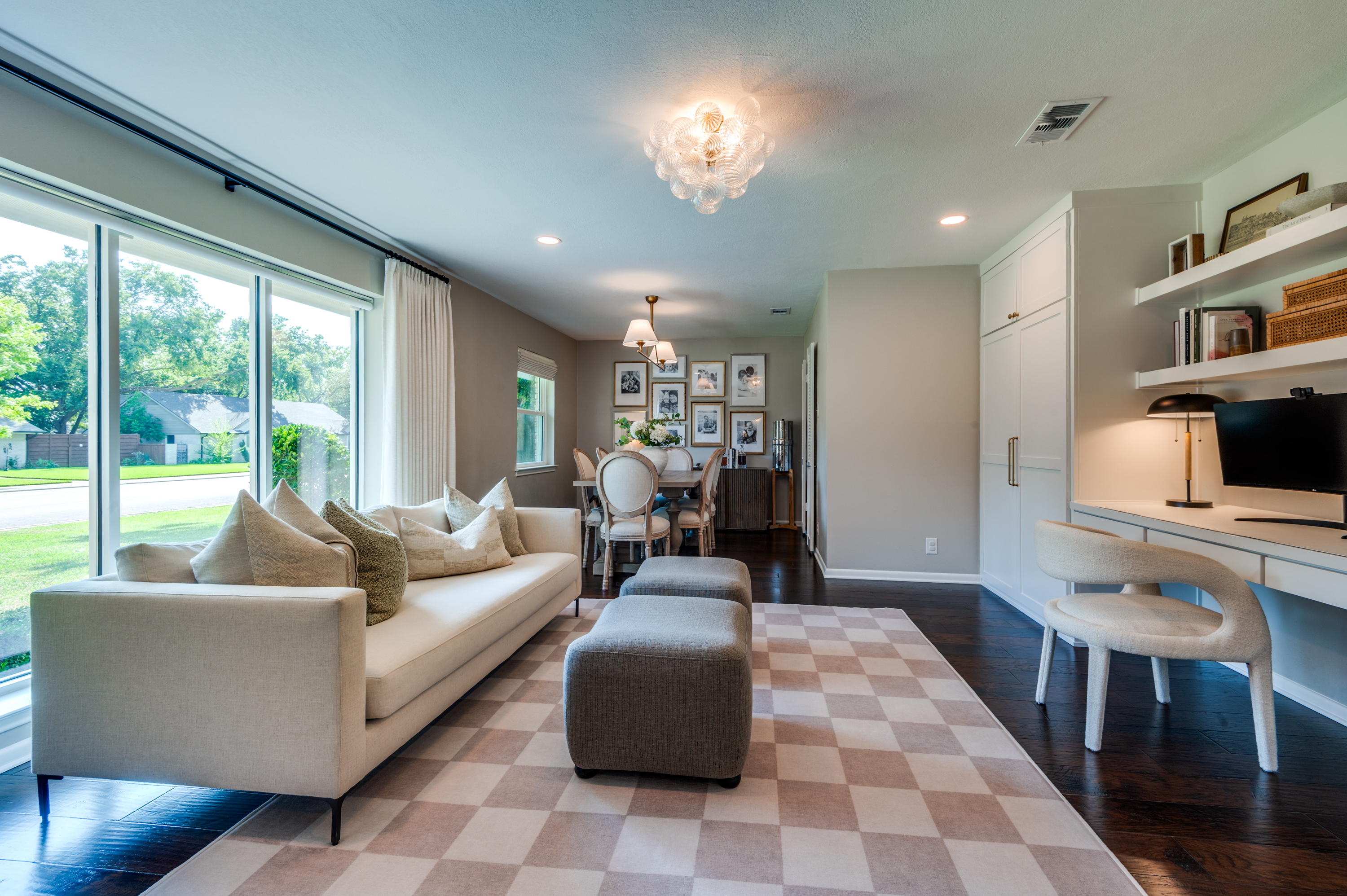 3363 Merrell Road Dallas, TX 75229 - Photo 2 of 29 a living room with furniture and a flat screen tv