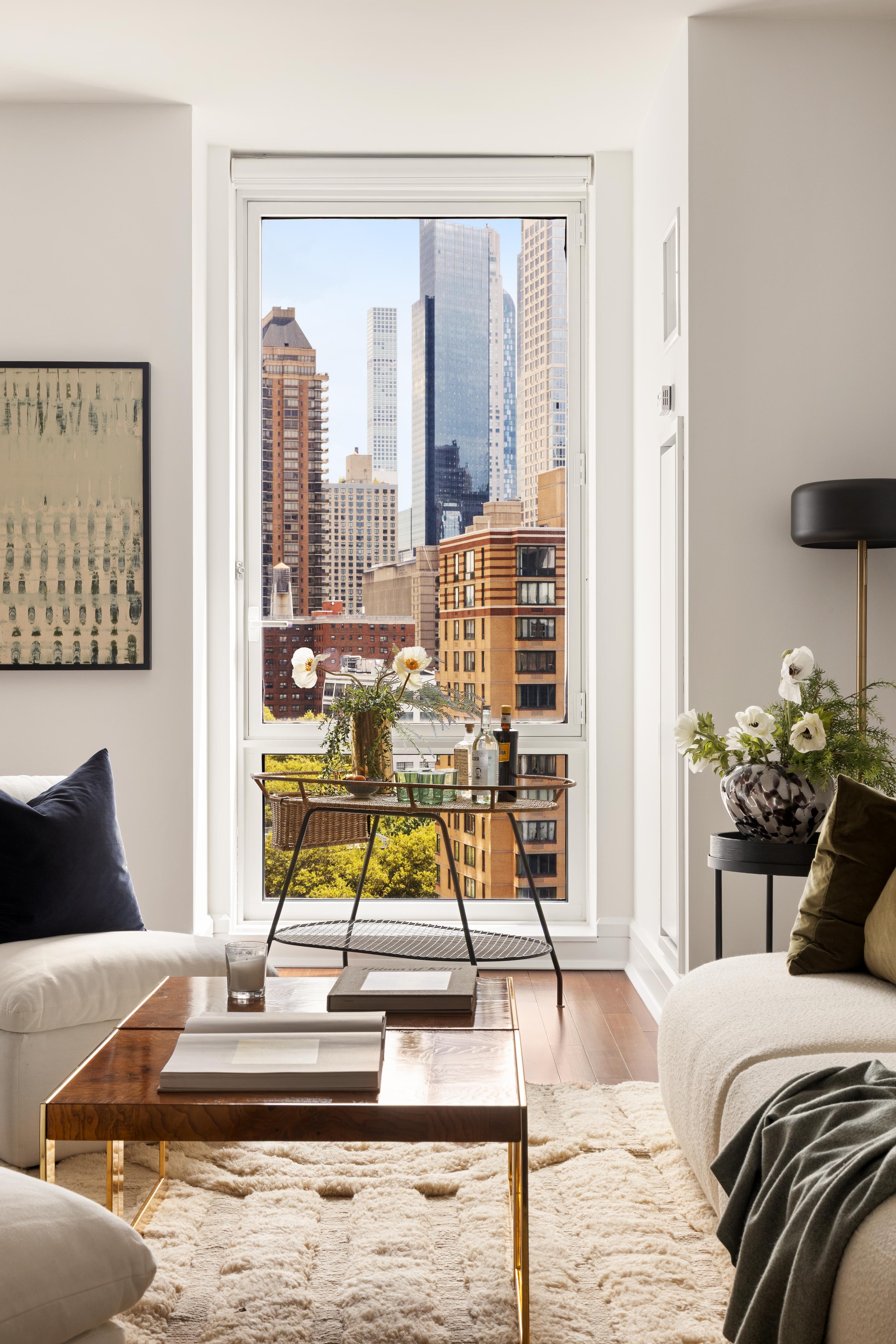 60 Riverside Boulevard, Unit 1508 Manhattan, NY 10069 - Photo 3 of 14 a living room with furniture and floor to ceiling windows