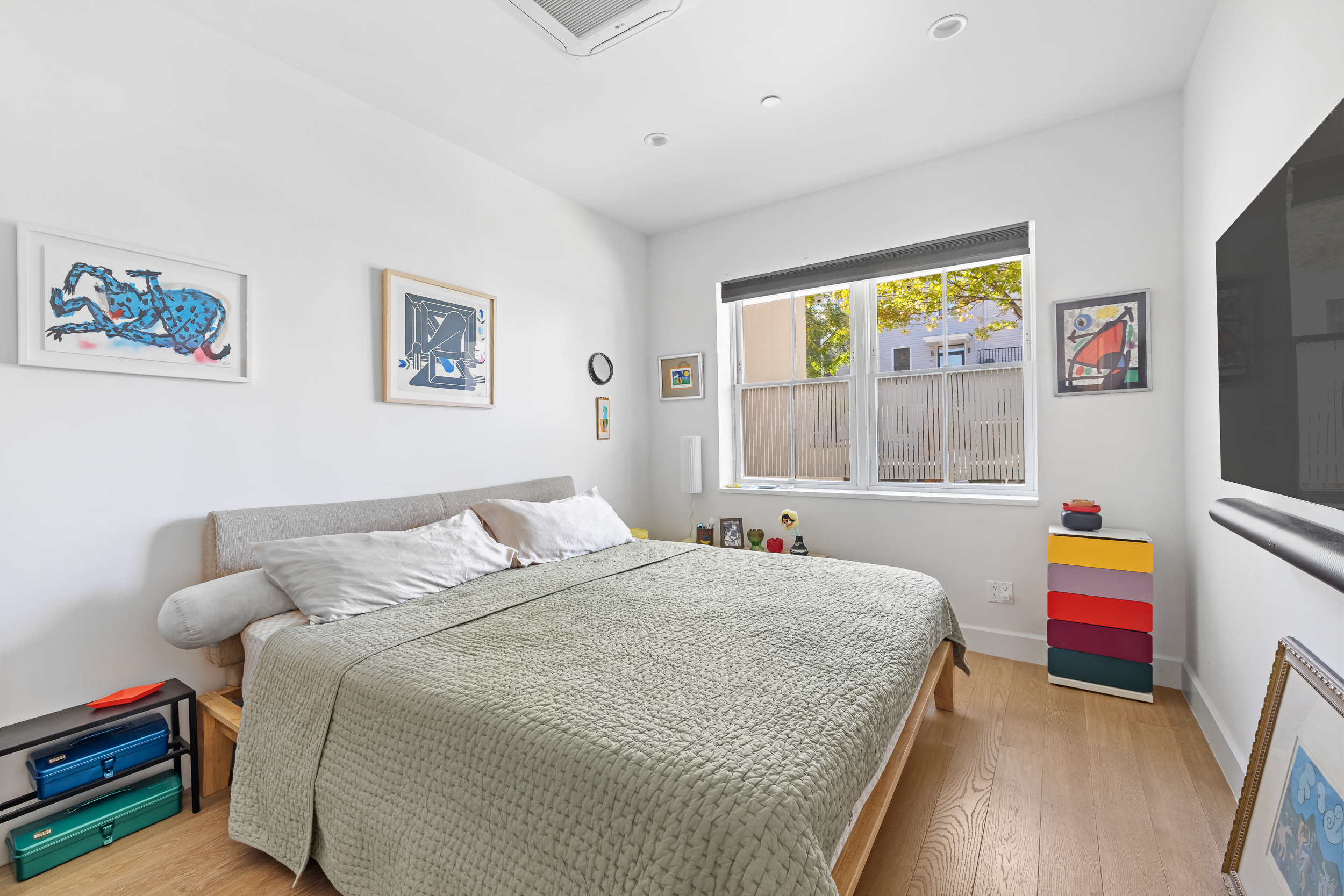 49 East 4th Street Brooklyn, NY 11218 - Photo 8 of 16 a bedroom with a bed and a large window