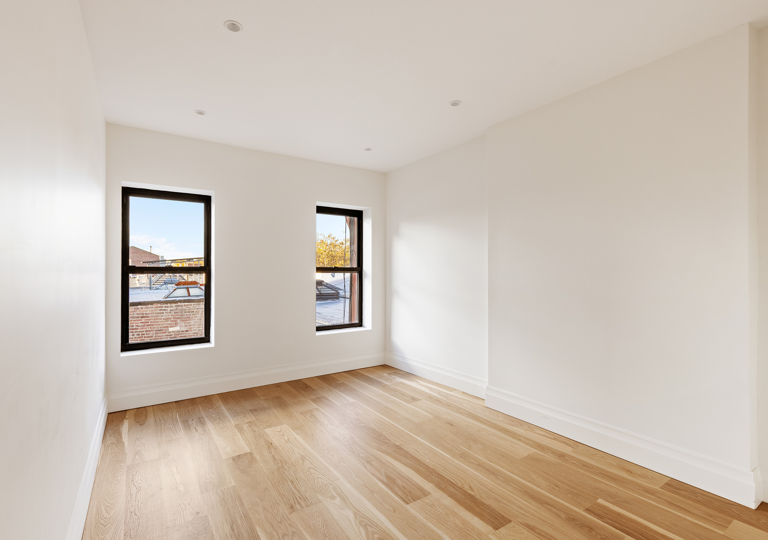 80 7th Avenue, Unit 4 Brooklyn, NY 11217 - Photo 4 of 9 an empty room with windows