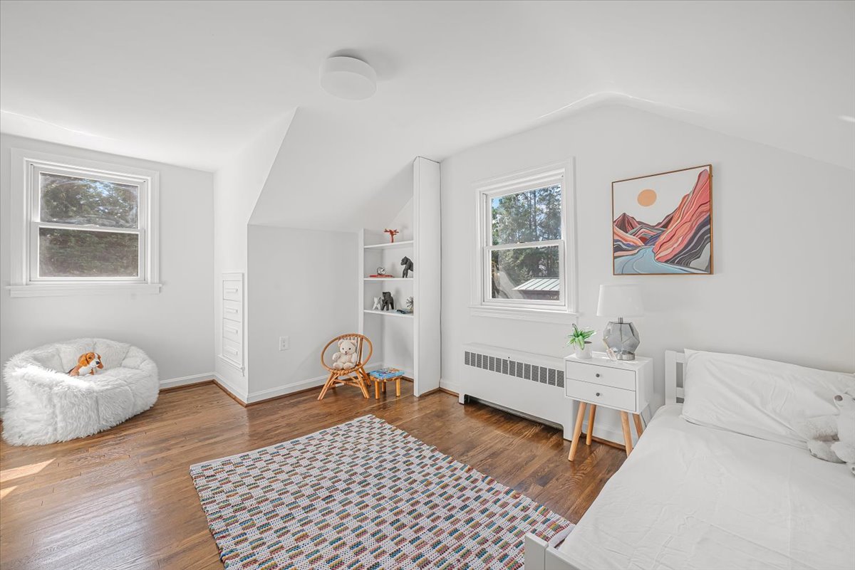 1902 Rookwood Road Silver Spring, MD 20910 - Photo 24 of 36 a bedroom with a bed and wooden floor