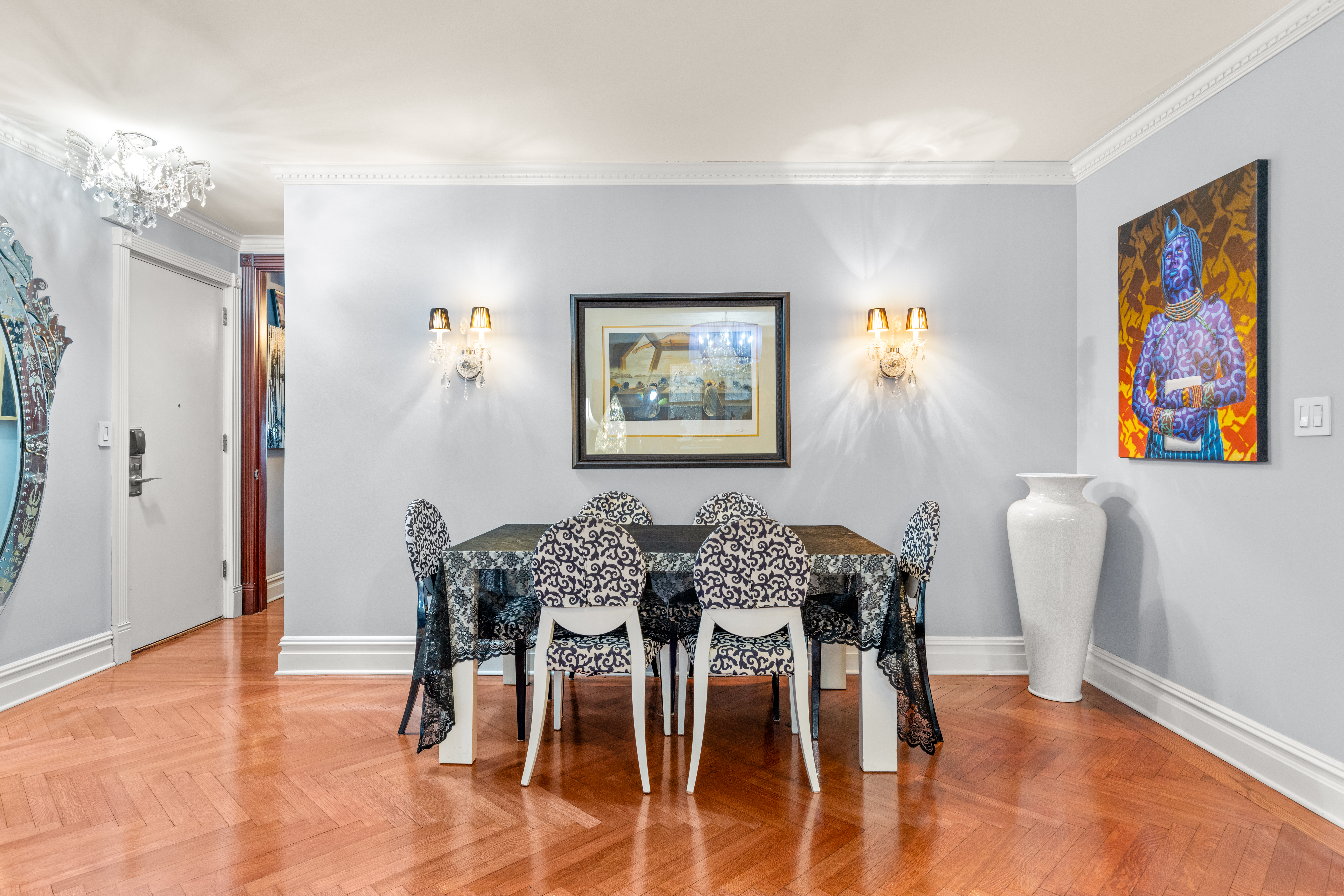575 Park Avenue, Unit 108 Manhattan, NY 10065 - Photo 3 of 18 a view of a dining room with furniture and wooden floor