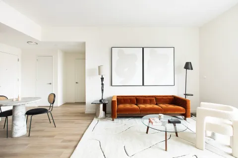 a living room with furniture and a window