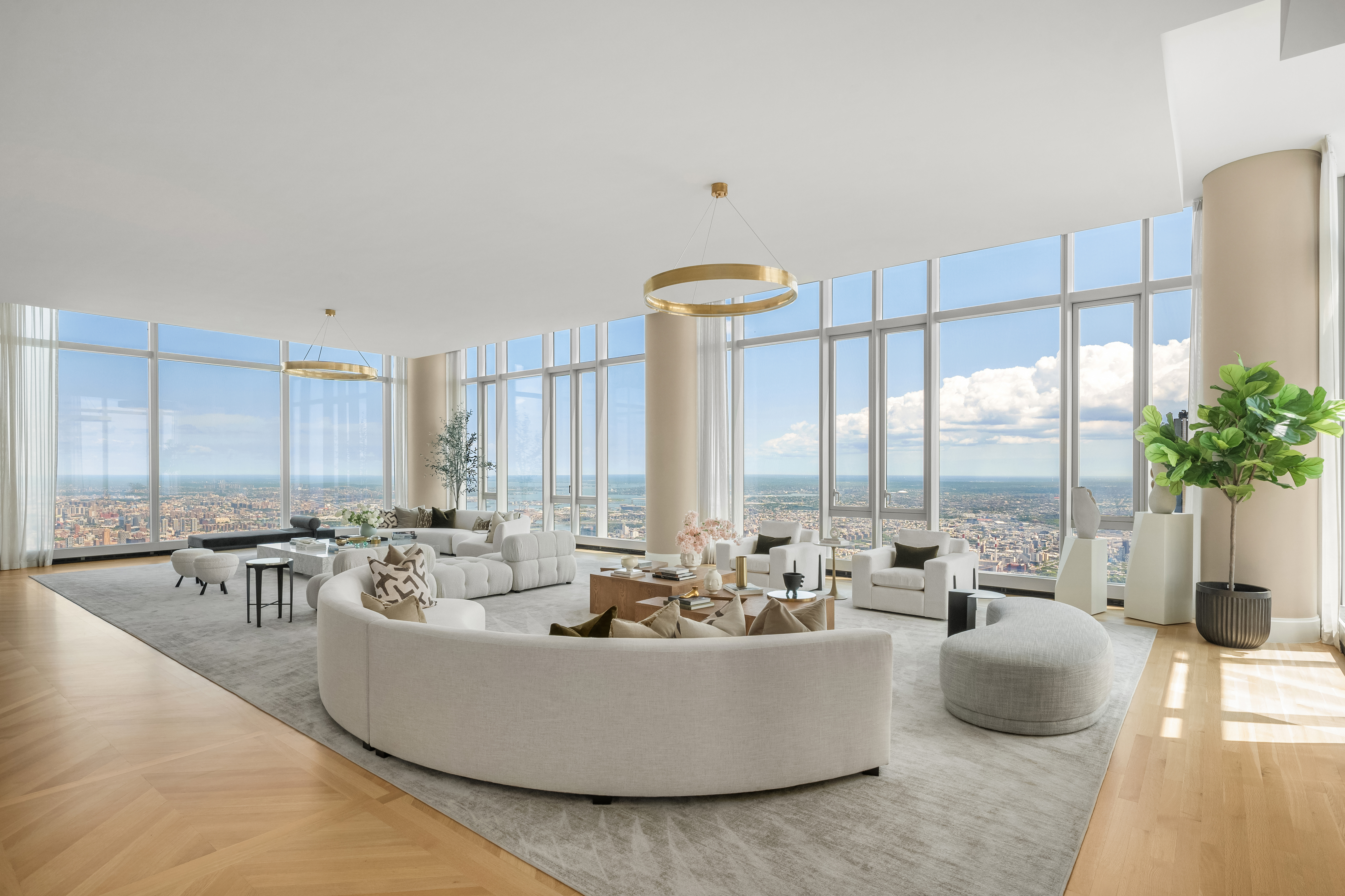 217 West 57th Street, Unit 127/128 Manhattan, NY 10019 - Photo 3 of 36 a living room with furniture and a large window