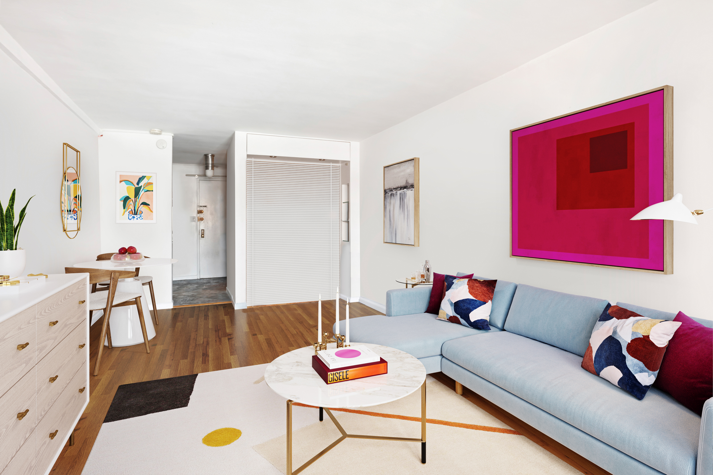 165 Christopher Street, Unit 6J Manhattan, NY 10014 - Photo 3 of 16 a living room with furniture and a wooden floor