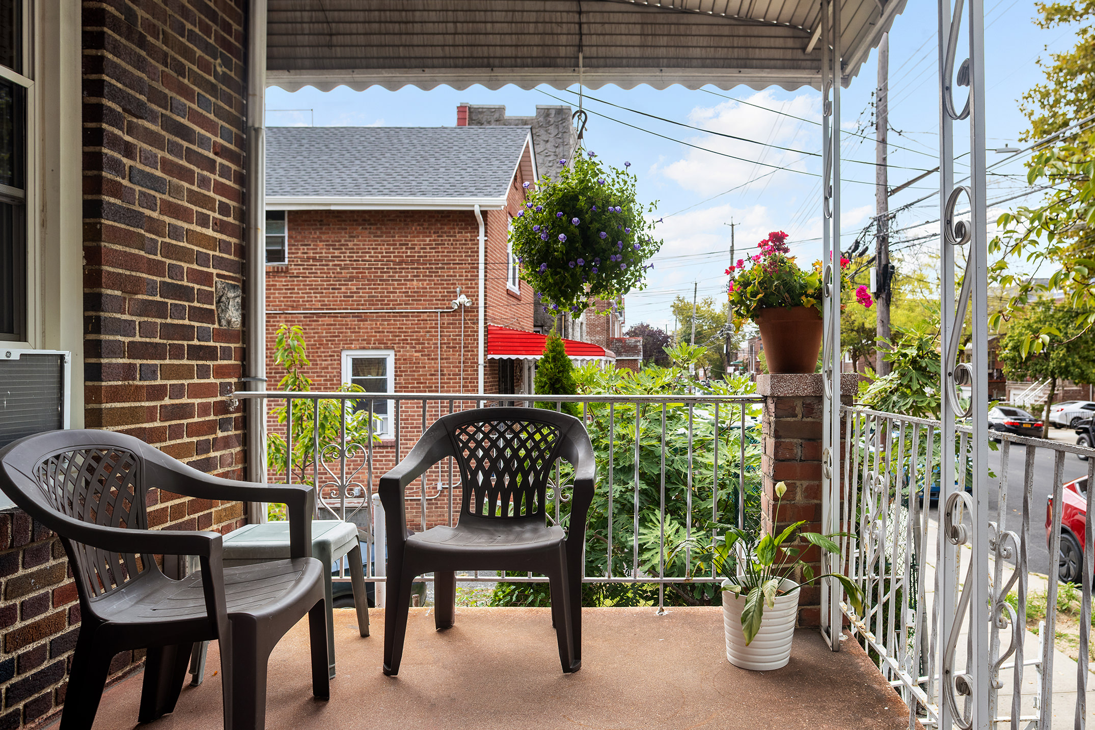 2536 Lurting Avenue Bronx, NY 10469 - Photo 22 of 27 a patio with table and chairs and potted plants