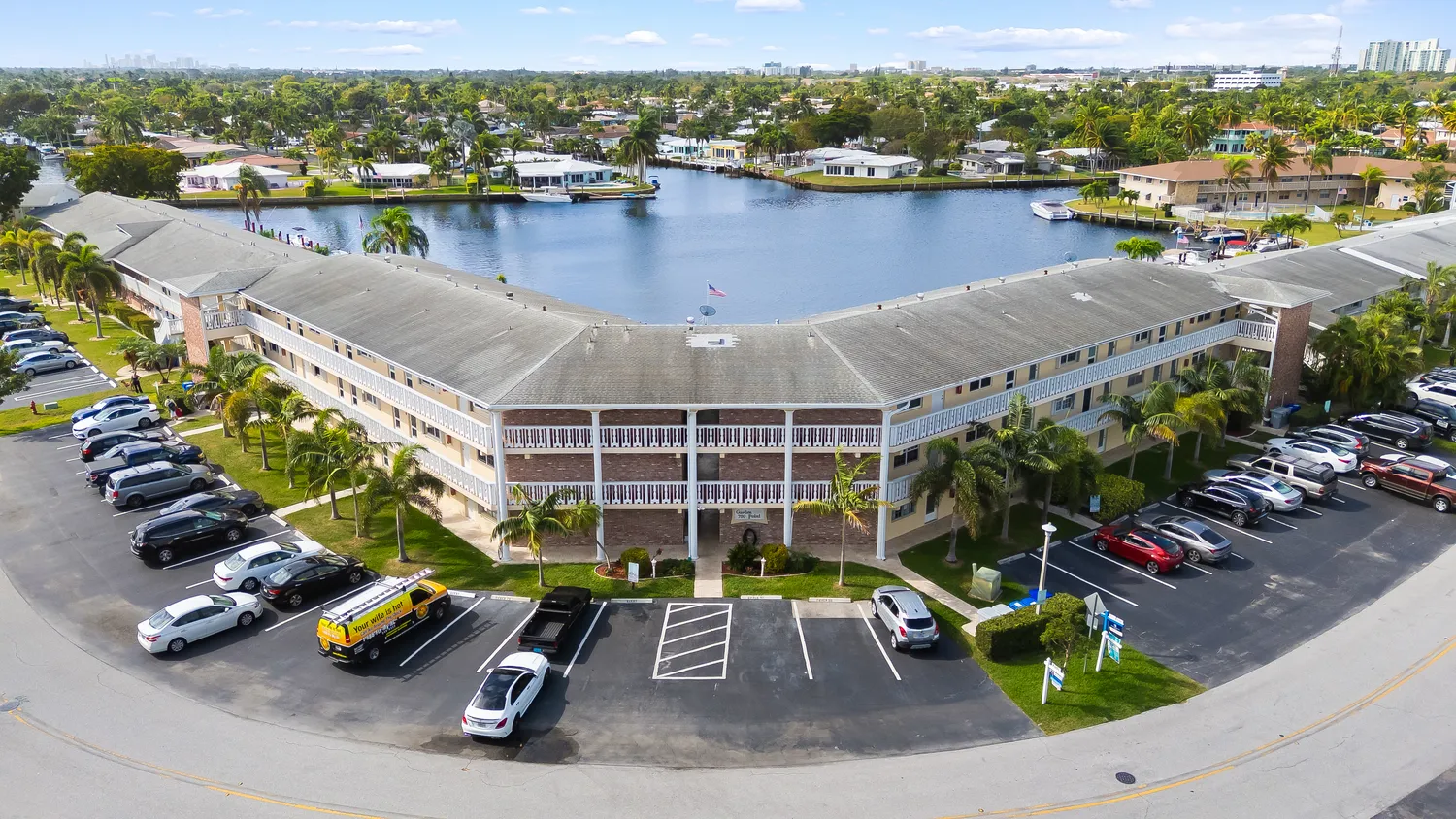 a kitchen with stainless steel appliances kitchen island granite countertop a refrigerator and a stove top oven