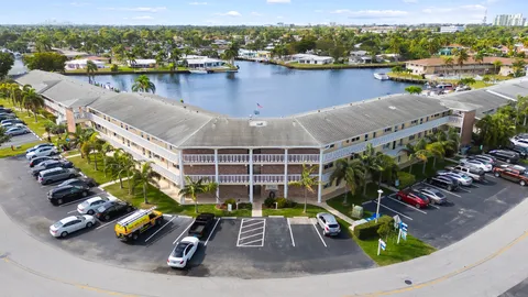 a kitchen with stainless steel appliances kitchen island granite countertop a refrigerator and a stove top oven
