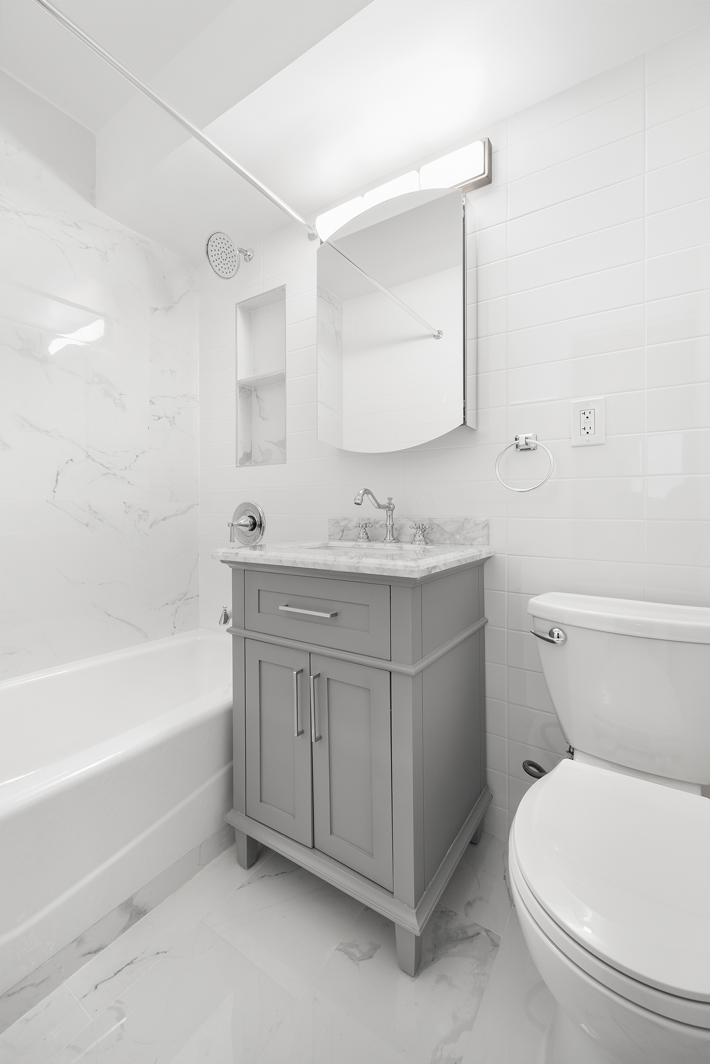 122 Ashland Place, Unit 12L Brooklyn, NY 11201 - Photo 7 of 16 a bathroom with a sink toilet vanity and bathtub