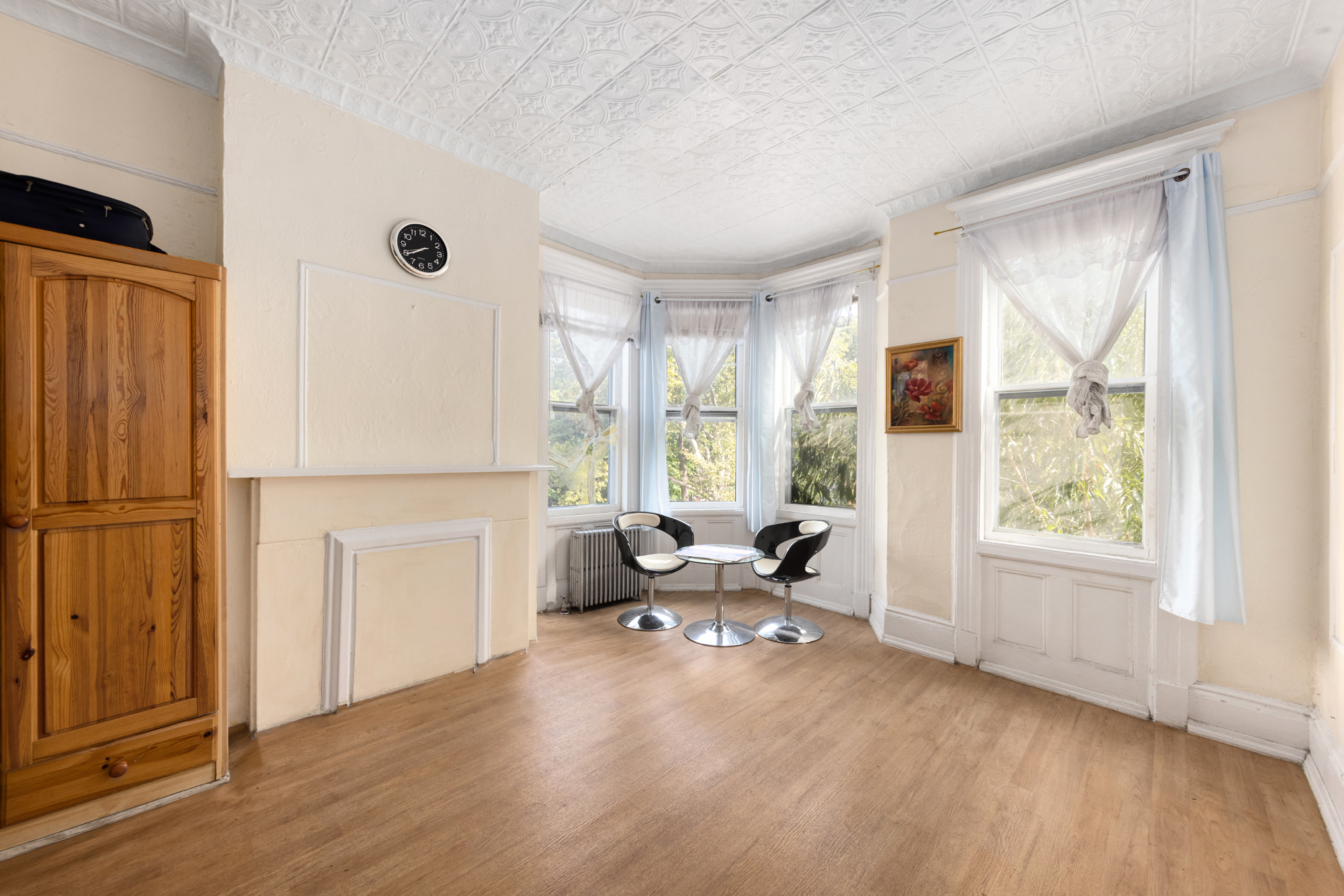 221 Nassau Avenue Brooklyn, NY 11222 - Photo 5 of 11 a living room with furniture and a window